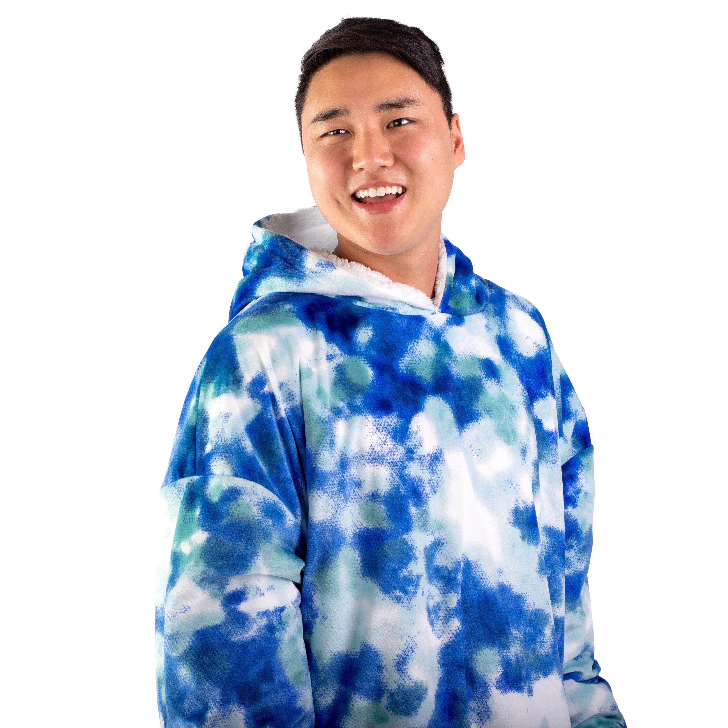 An adult with a sherpa wearable blanket on