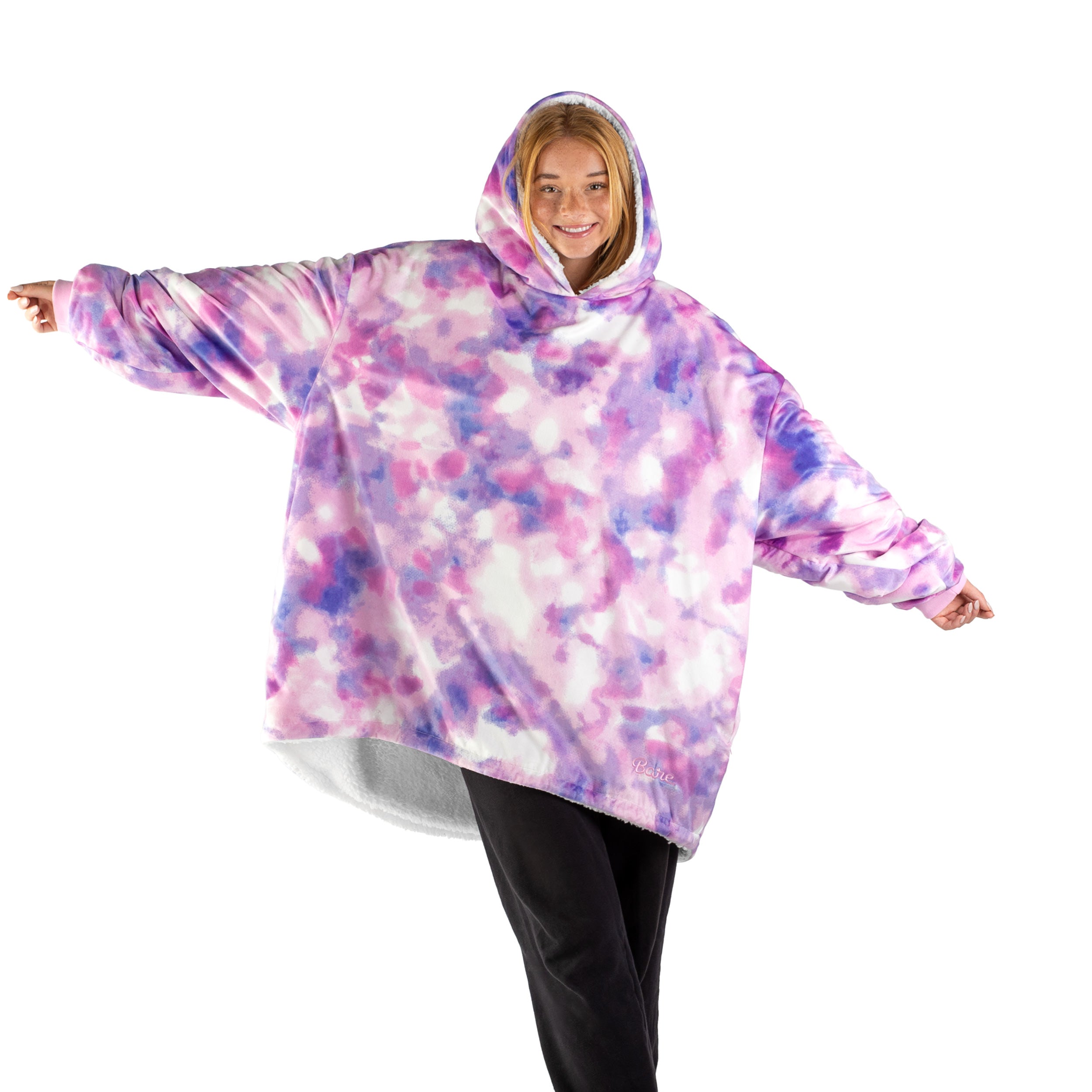 An adult with a sherpa wearable blanket on