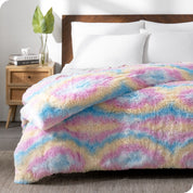 A tie dye shaggy duvet cover on a bed