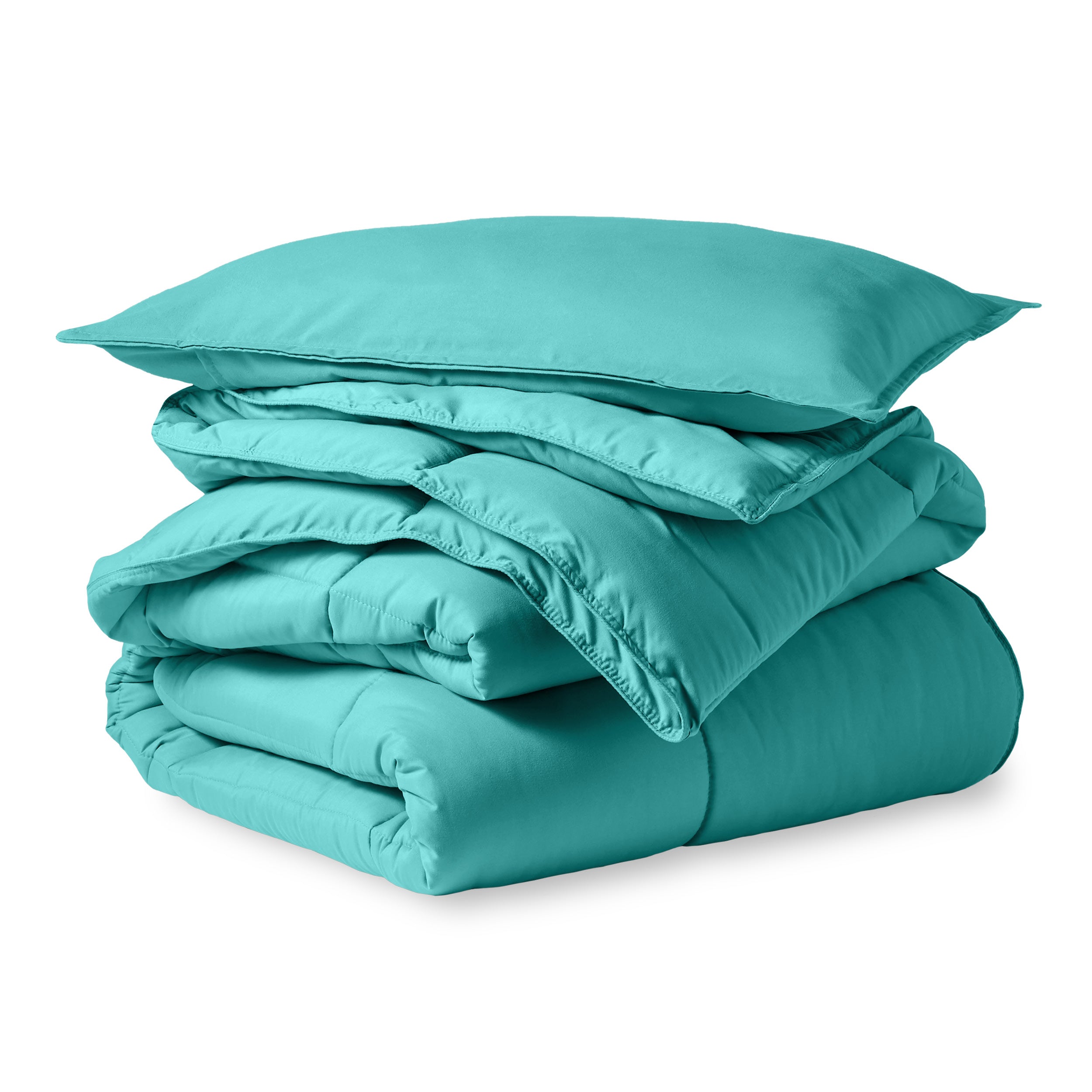 A microfiber comforter folded neatly with a pillow from above