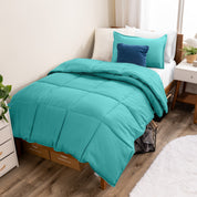 A modern bed with a down alternative comforter set on it