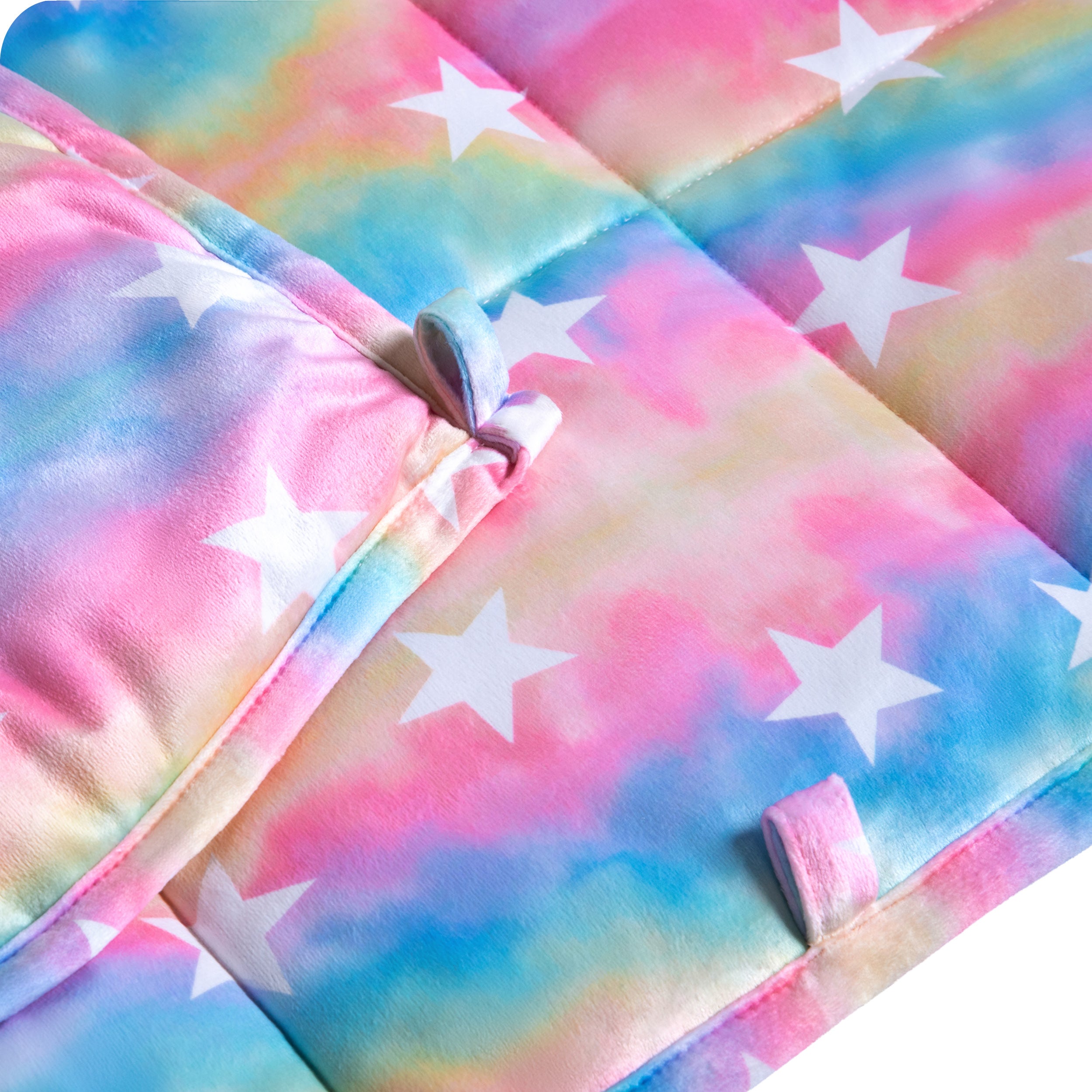 Close-up image of a weighted blanket, featuring detailed stitching and the edge of the blanket