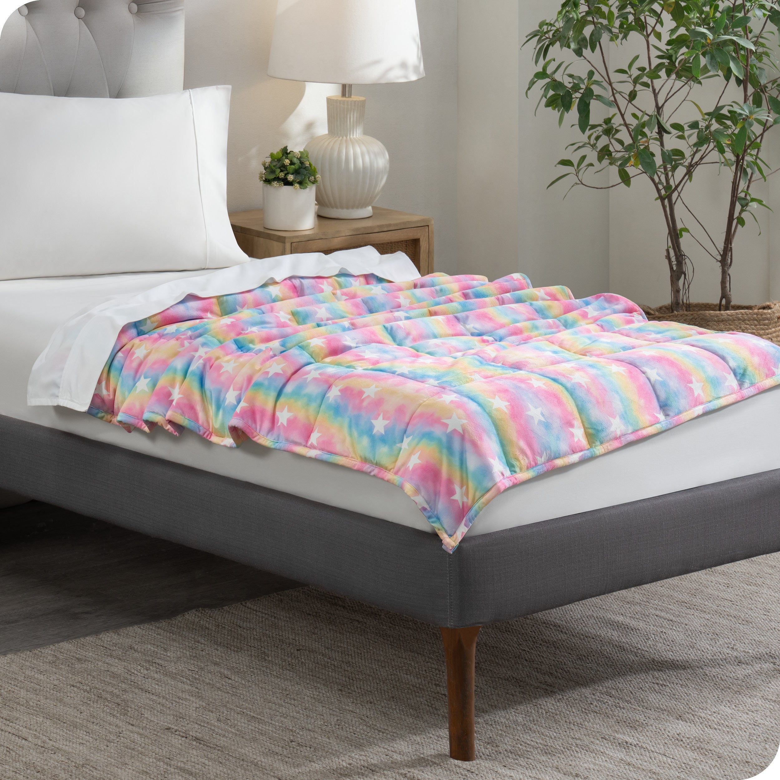 A weighted blanket laid out on a bed