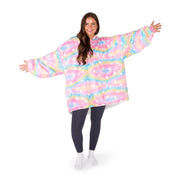 An adult with a hooded wearable blanket on