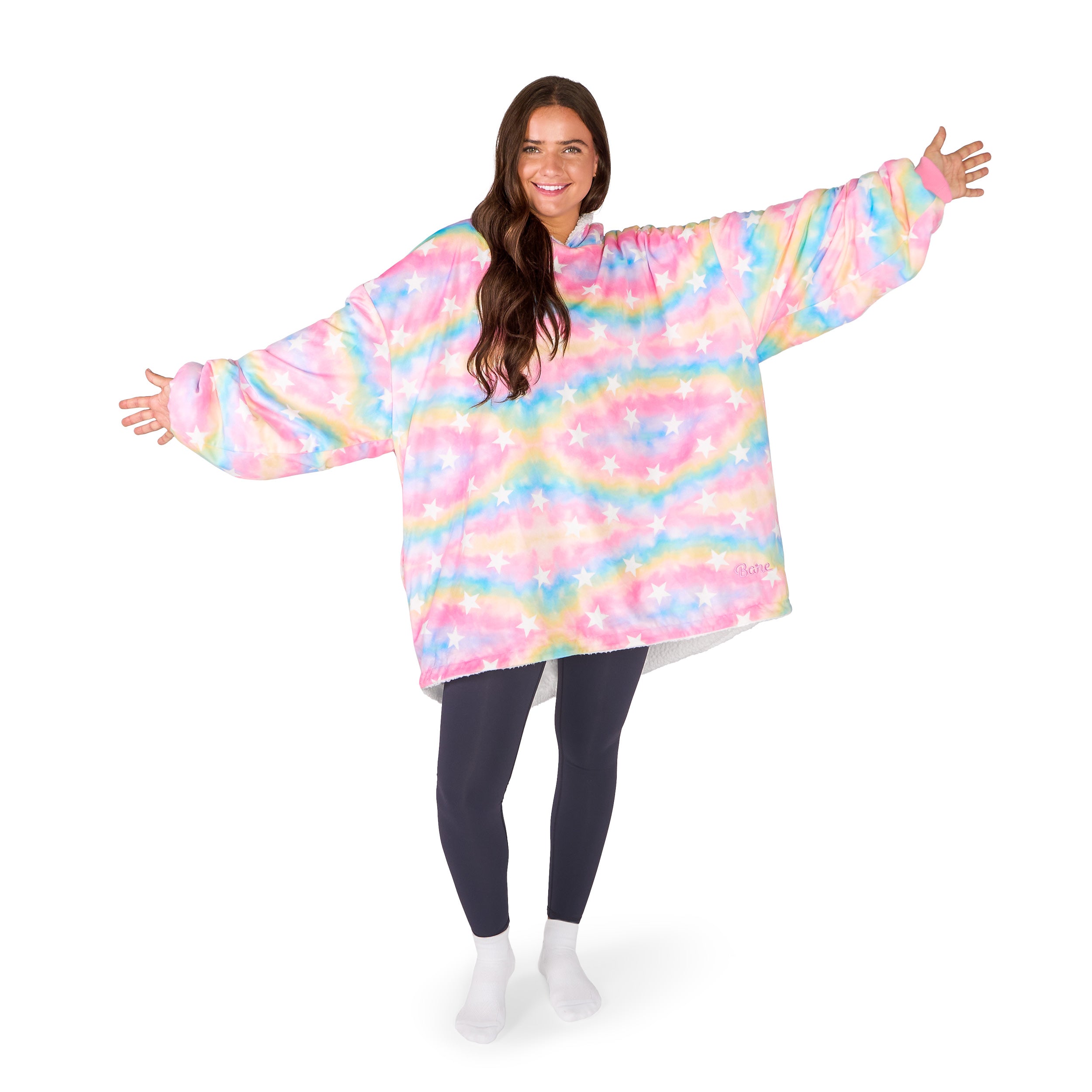 An adult with a hooded wearable blanket on