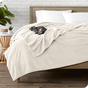 Microplush blanket laid out over a bed and folded back over itself