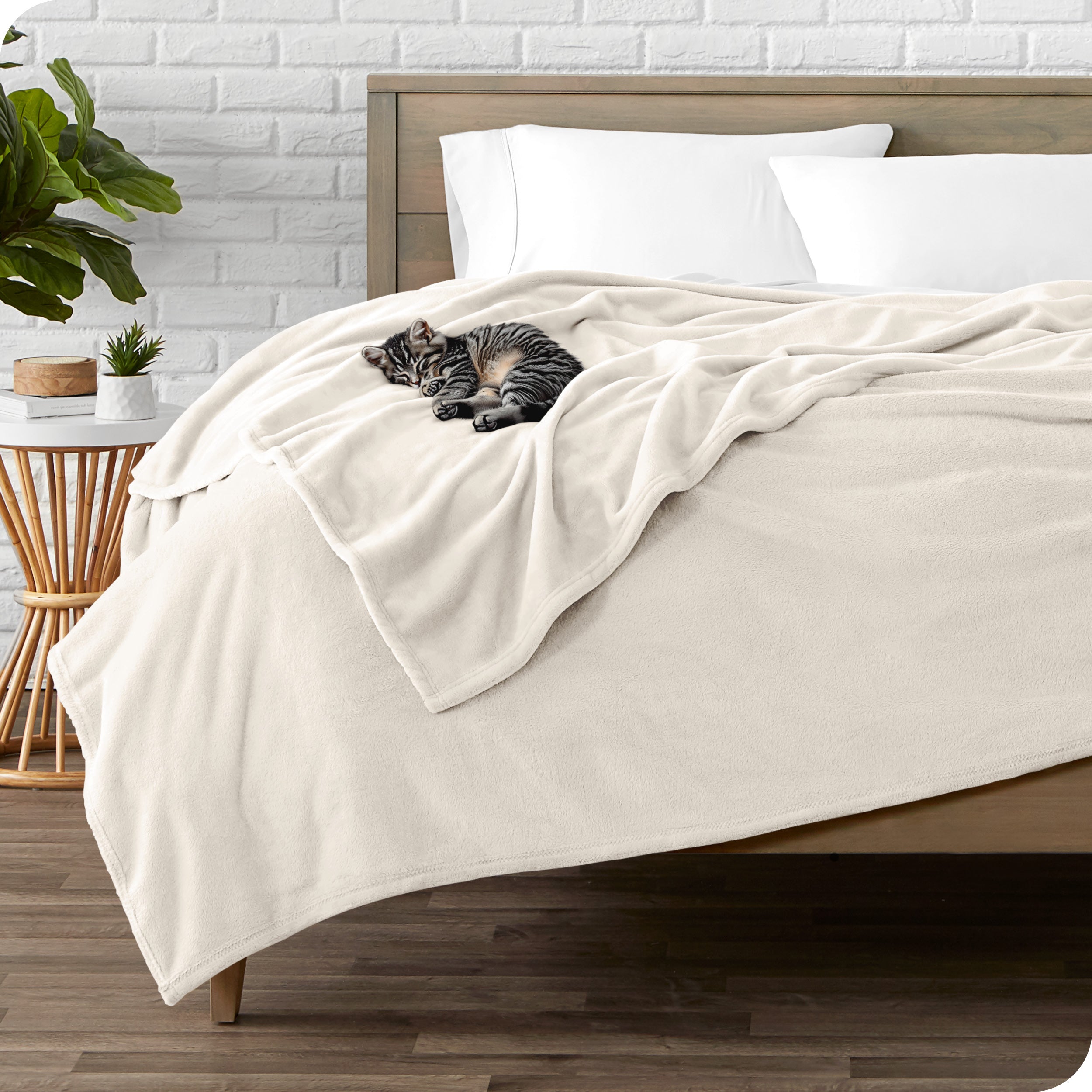 Microplush blanket laid out over a bed and folded back over itself