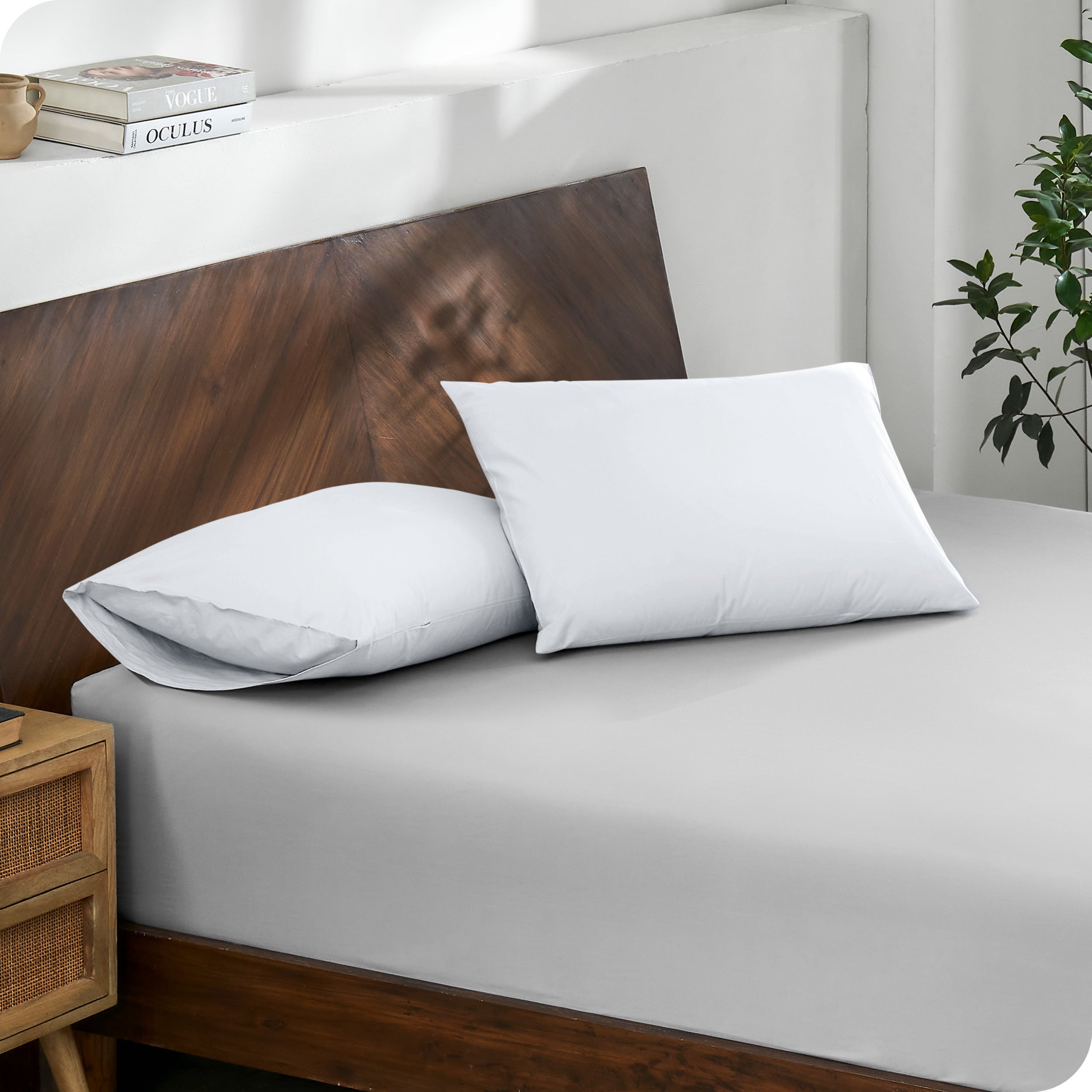 2 pillows with percale pillowcases on a bed