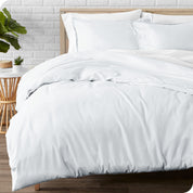 A modern bed with a flannel duvet cover set consisting of the duvet cover and two pillows.