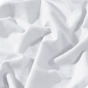 A close view of a button and lining on the flannel duvet cover.