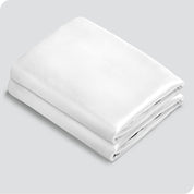 Two silk pillowcases folded and stacked neatly
