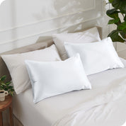 2 silk pillowcases on pillows set on a bed