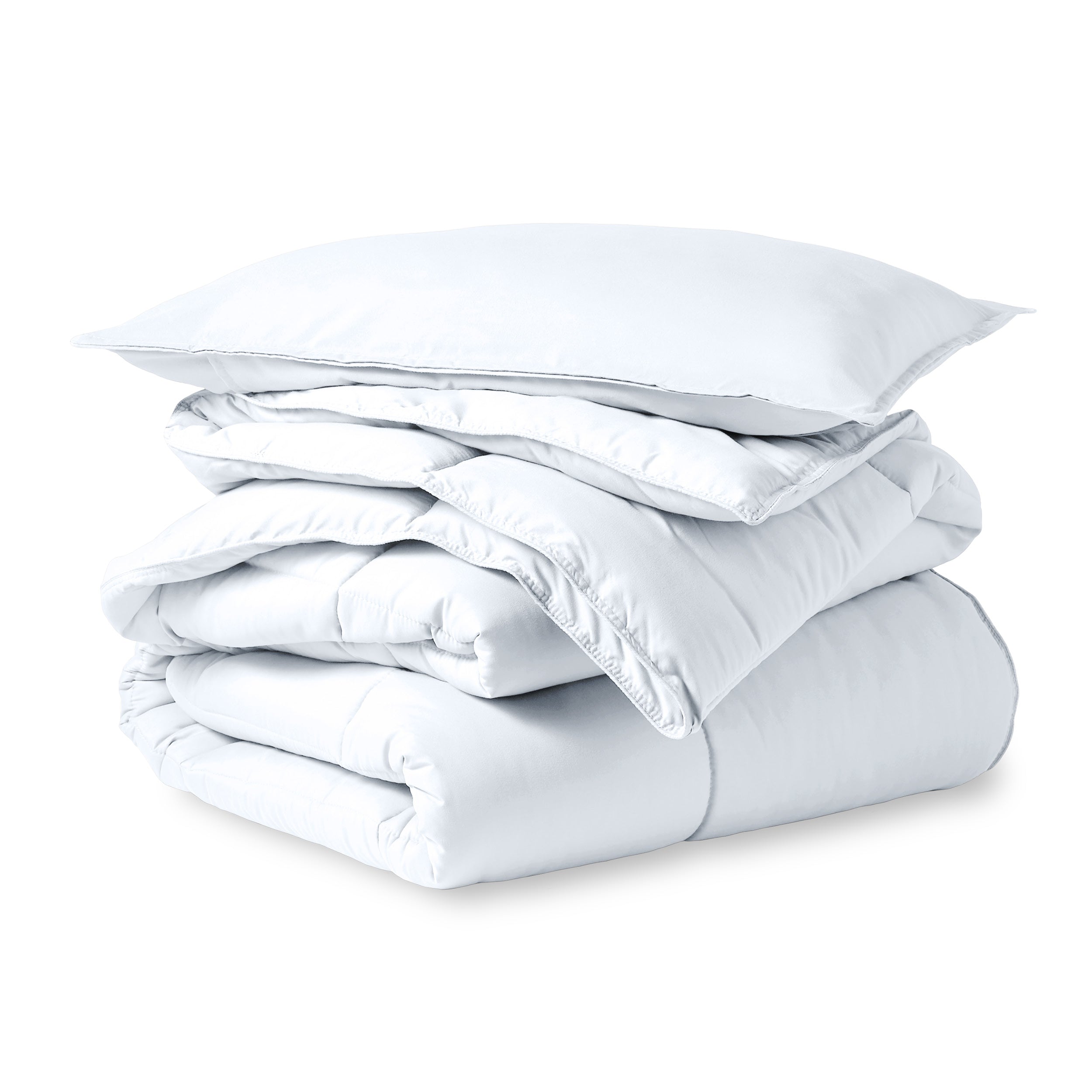 A microfiber comforter folded neatly with a pillow from above