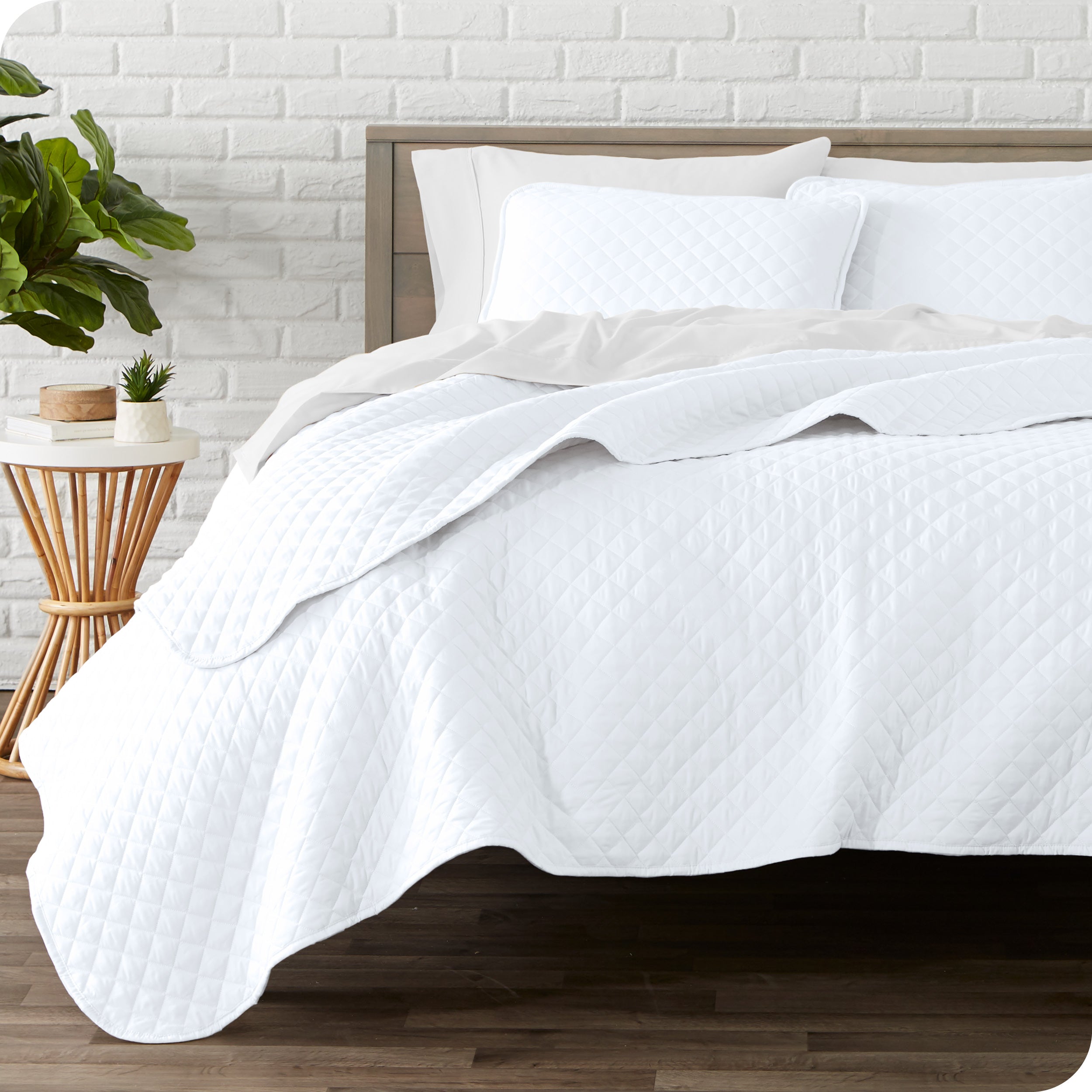 A quilted coverlet set on a bed