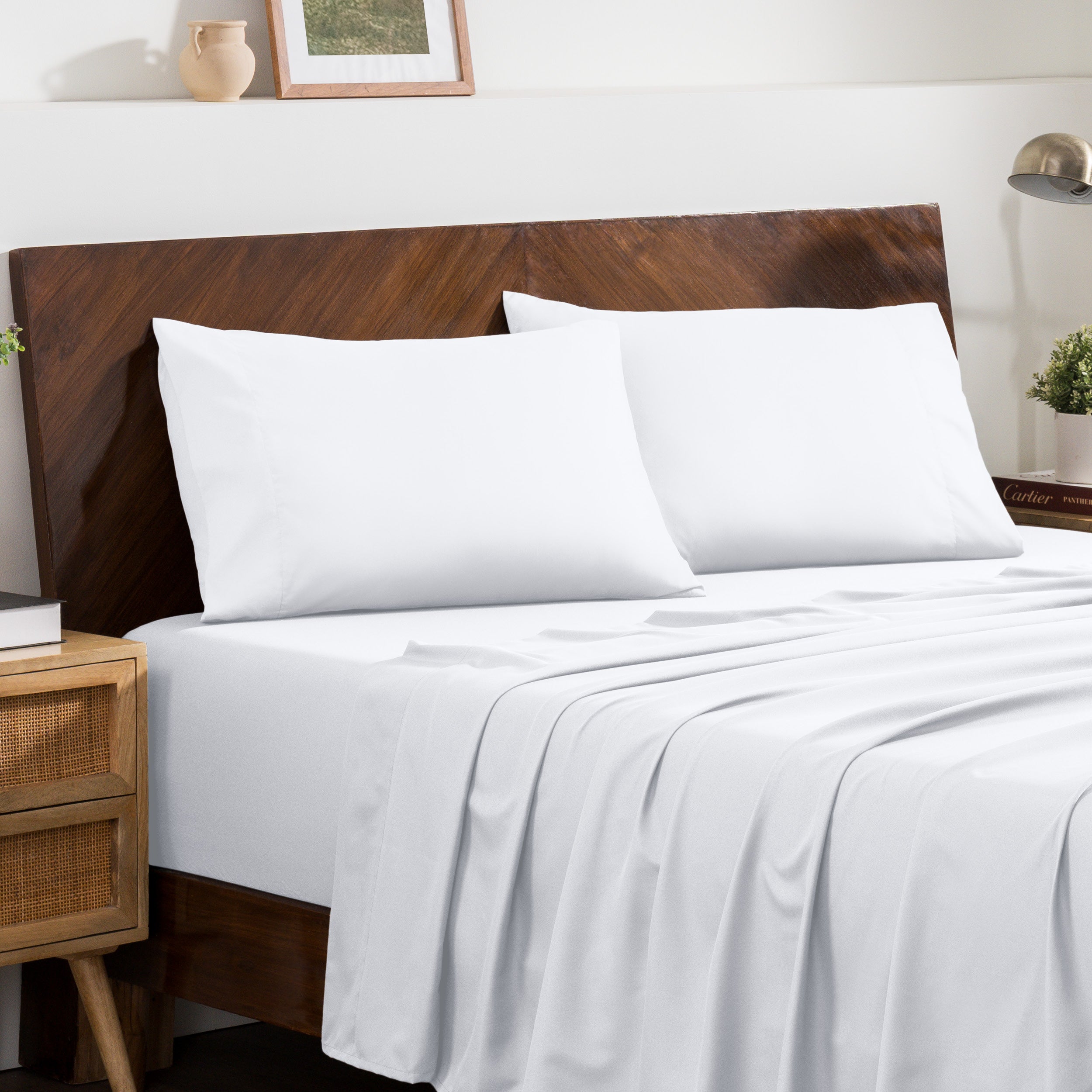 2 pillowcases on pillows on a nicely made bed