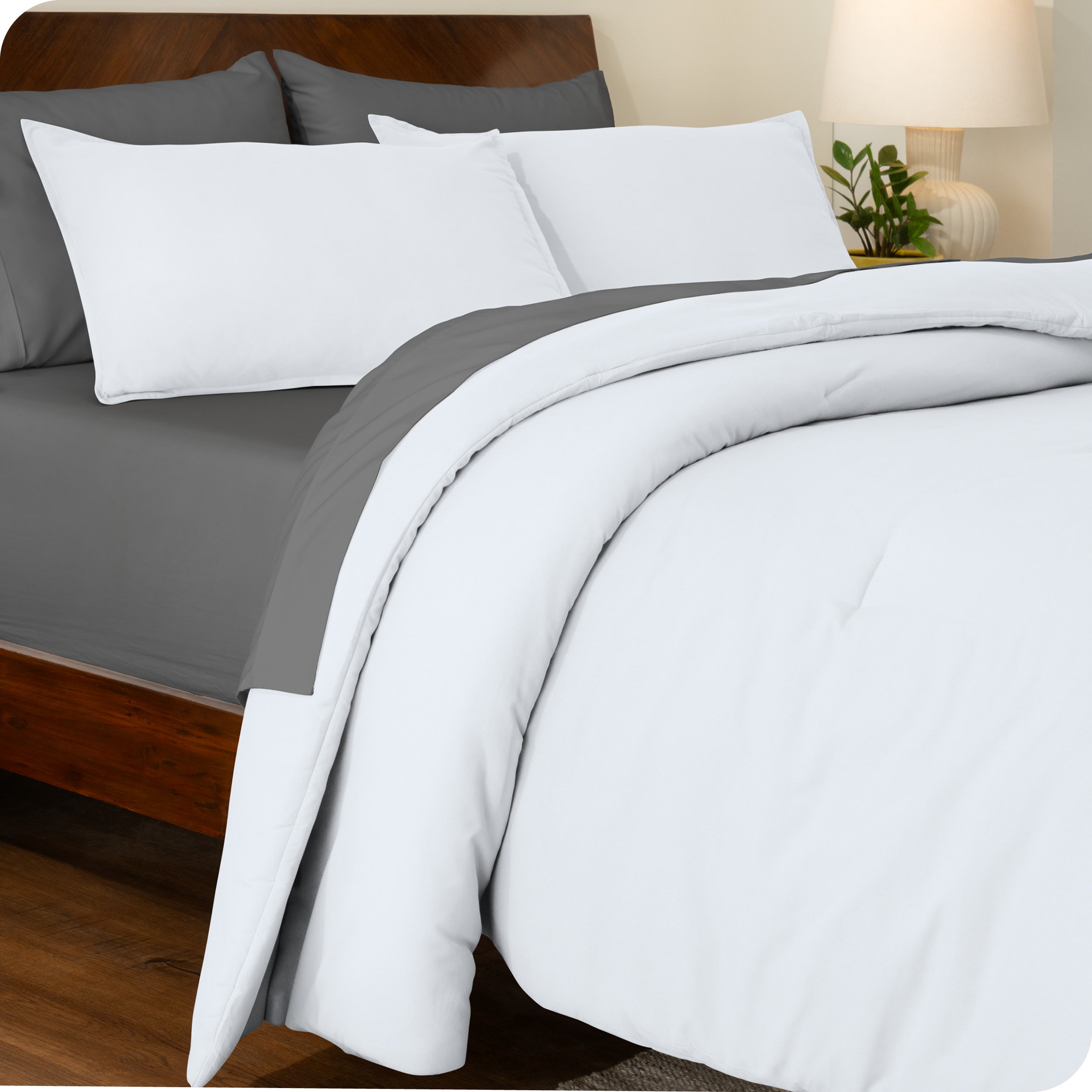 A side view of a bed made with a track stitch comforter set