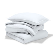 A comforter folded with a matching pillow sham stacked on top