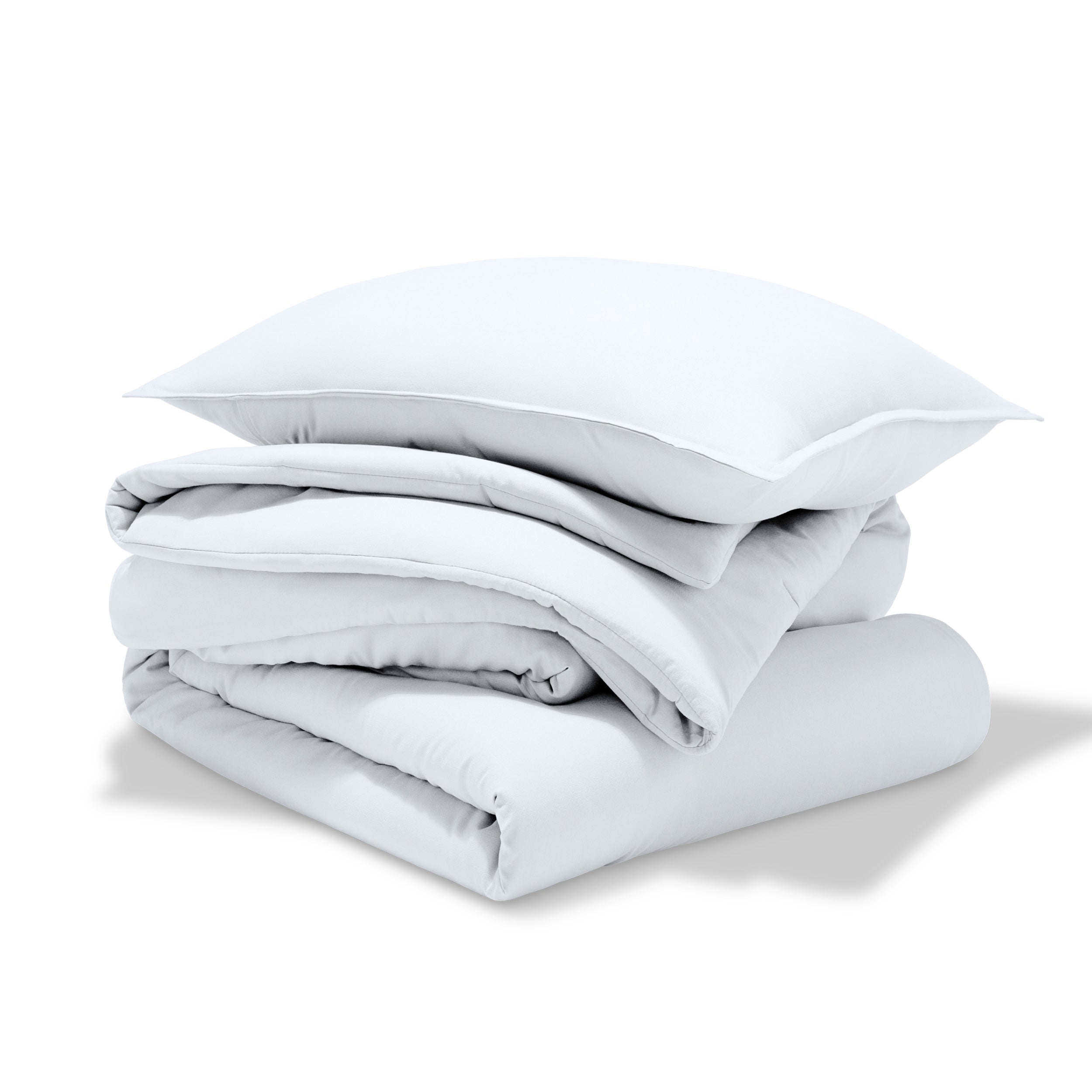 A comforter folded with a matching pillow sham stacked on top
