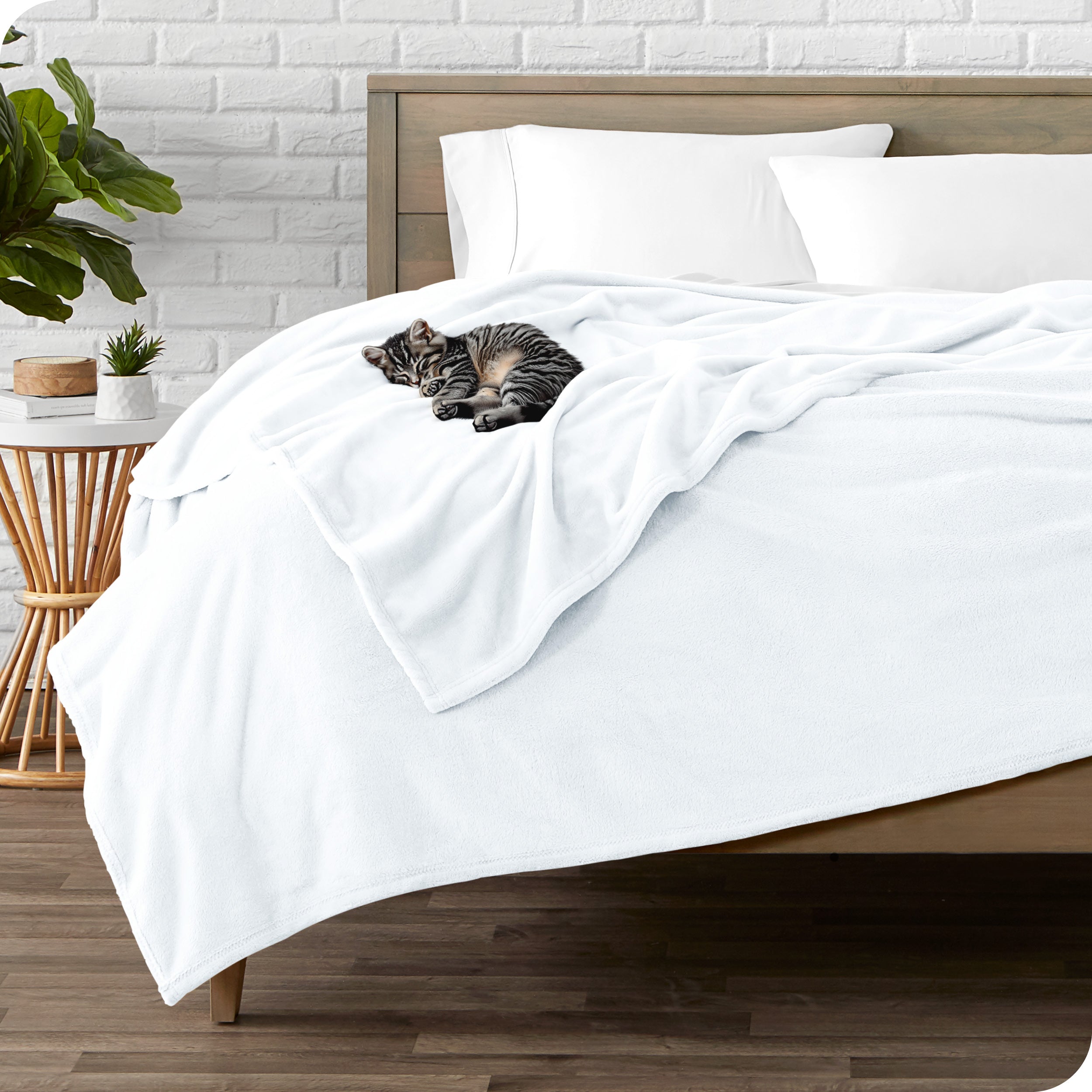 Microplush blanket laid out over a bed and folded back over itself
