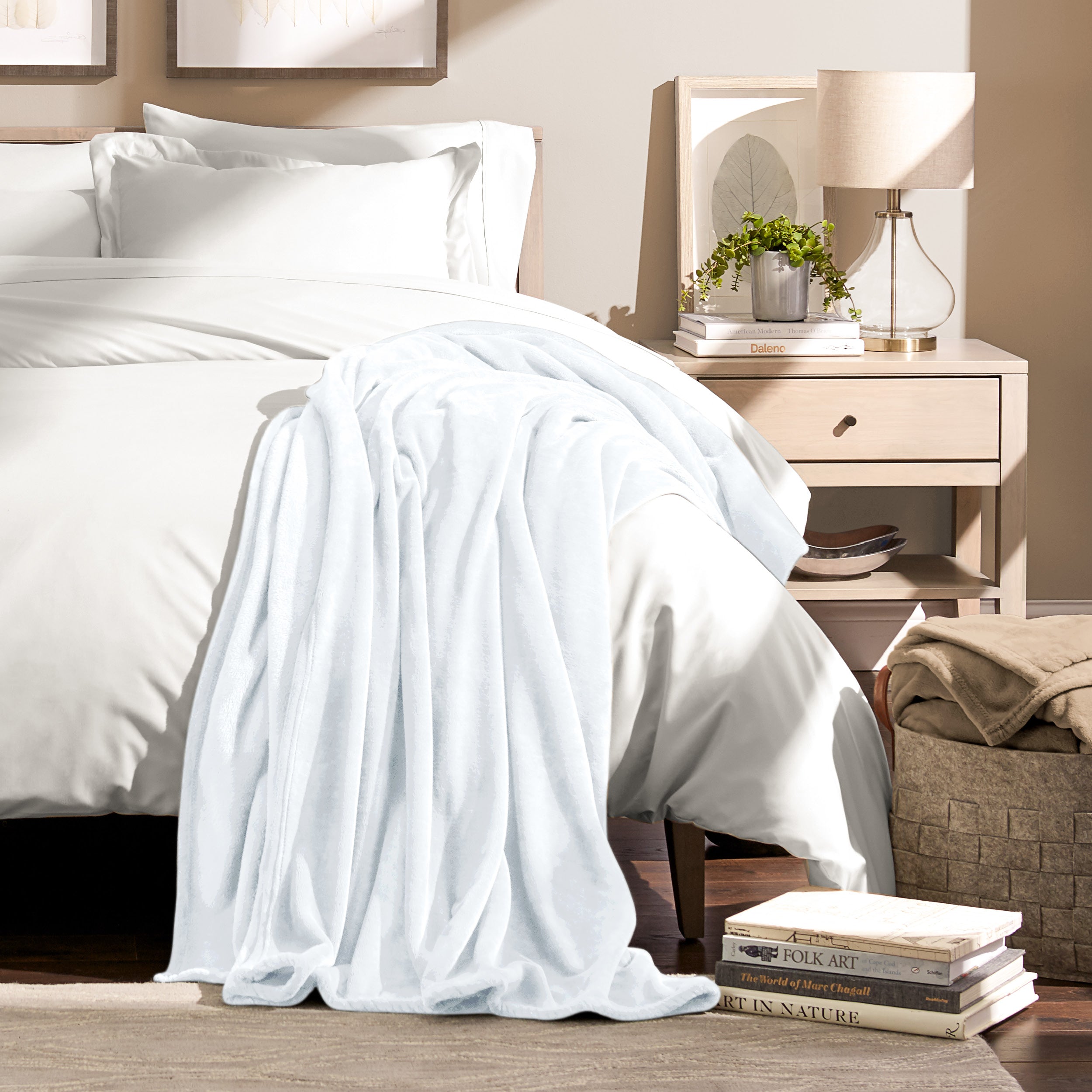 Microplush blanket laid out over a bed and folded back over itself
