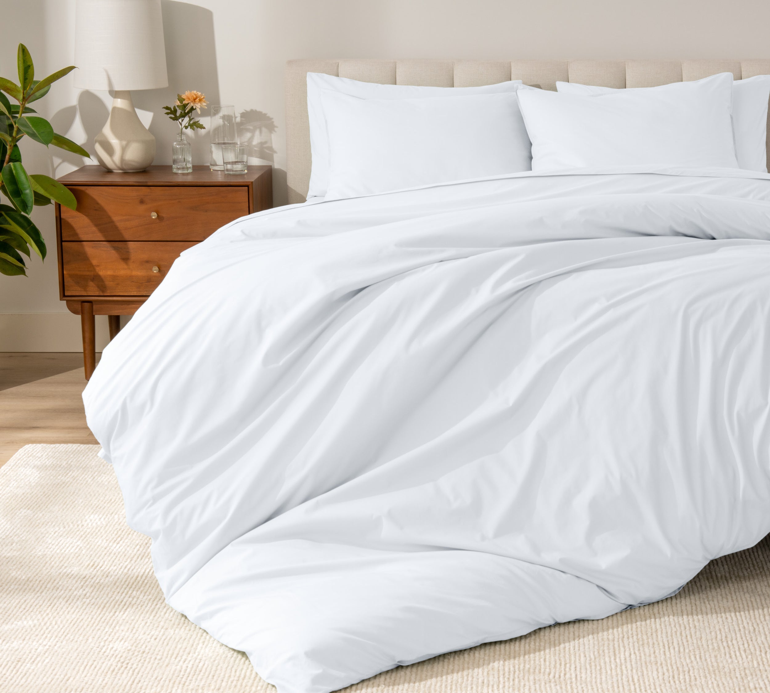 A modern bed with a organic cotton percale duvet cover on.