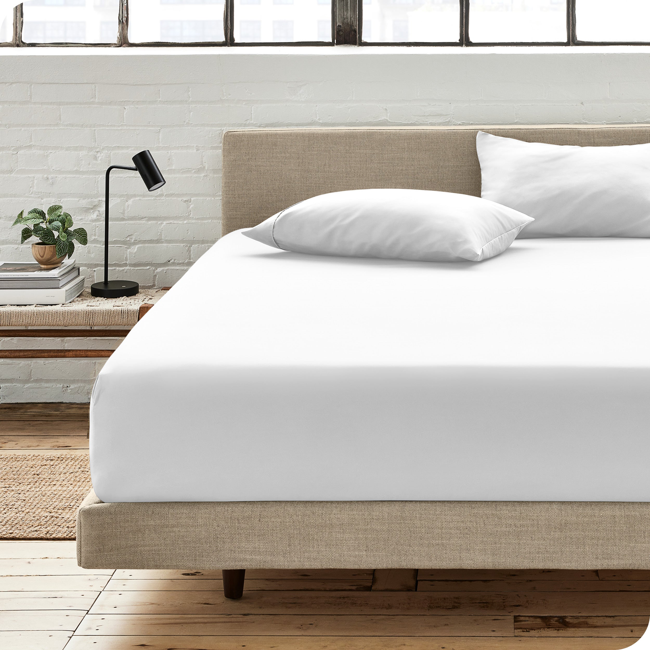 An organic cotton fitted sheet on a mattress
