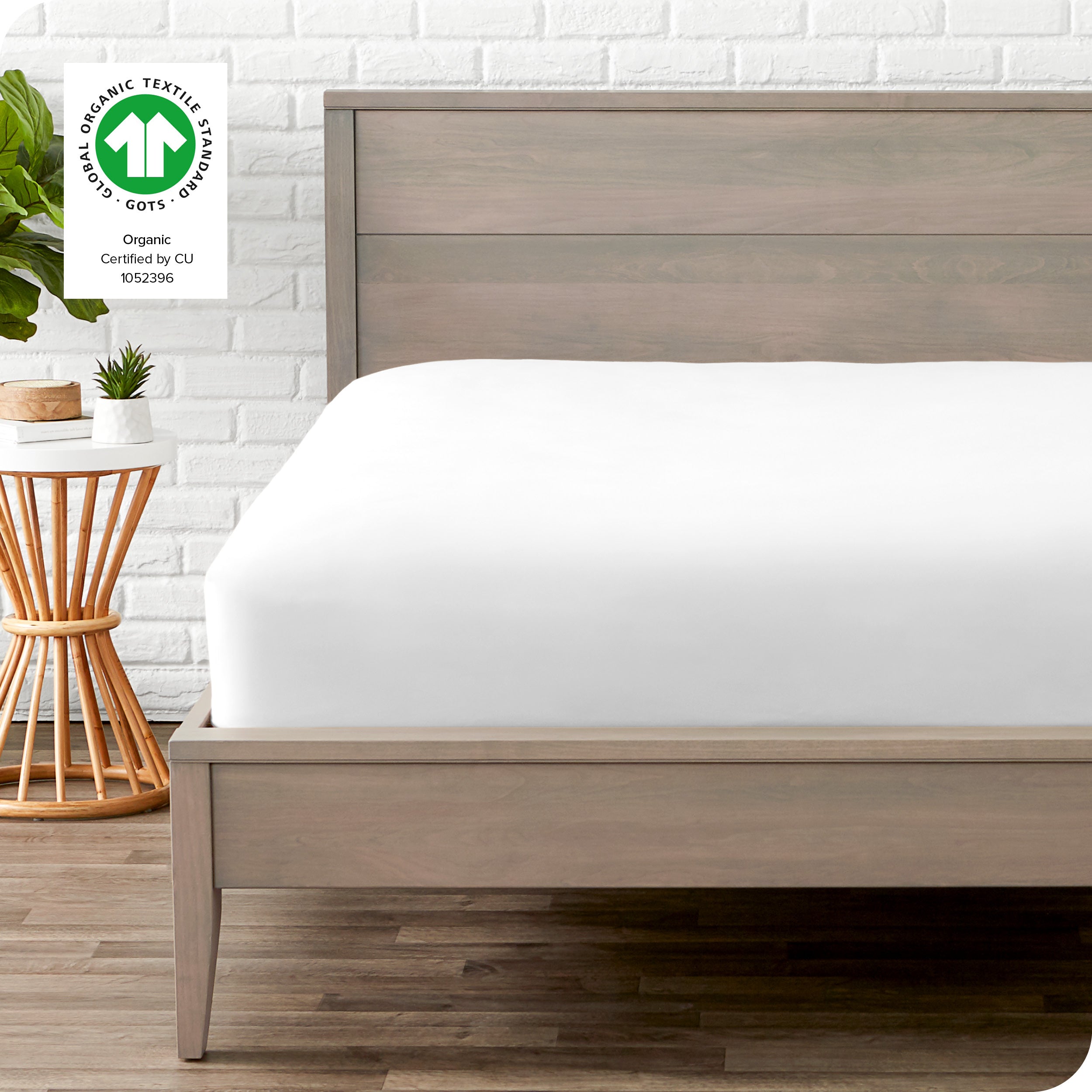An organic percale bottom sheet on a mattress