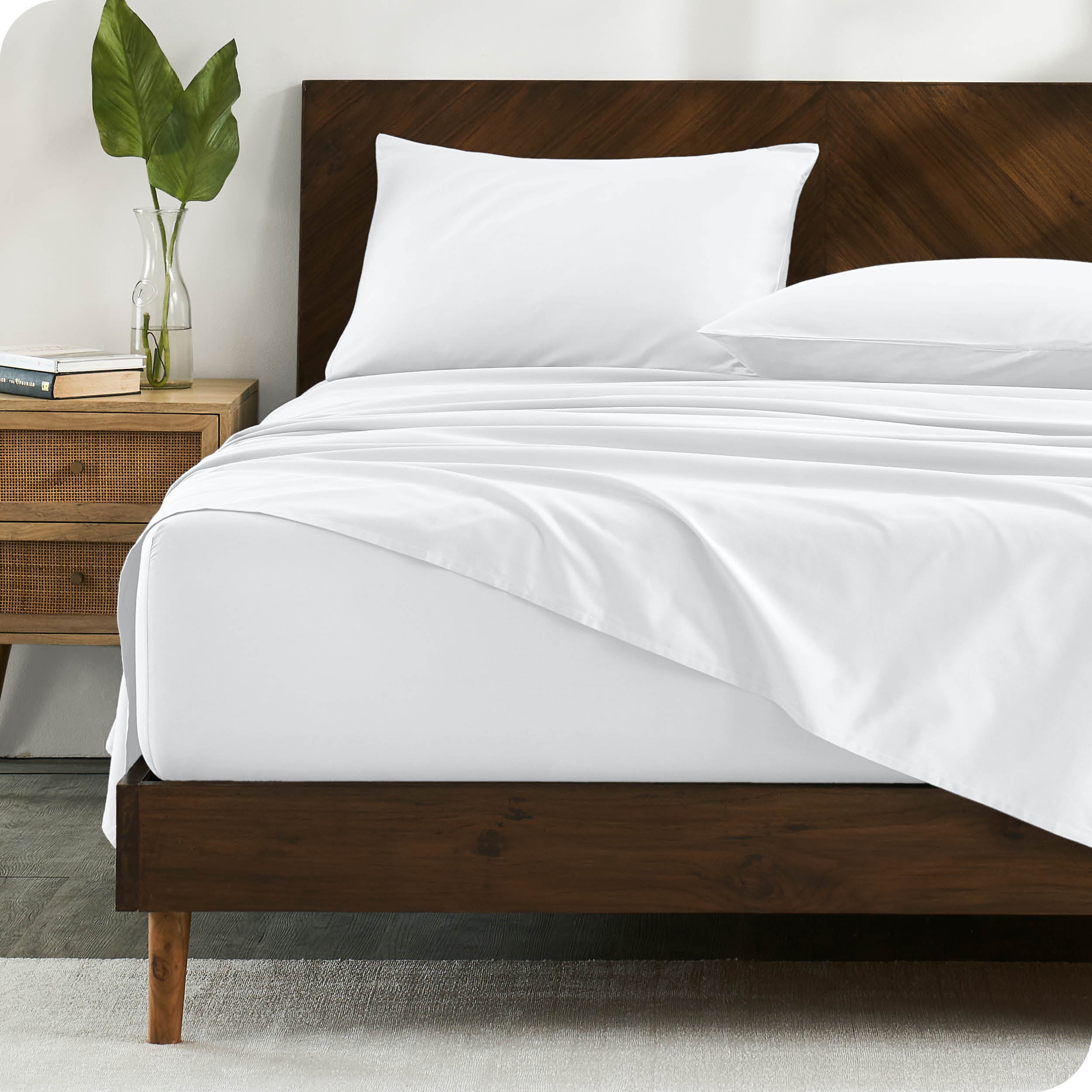 Percale sheets on bed in a modern bedroom