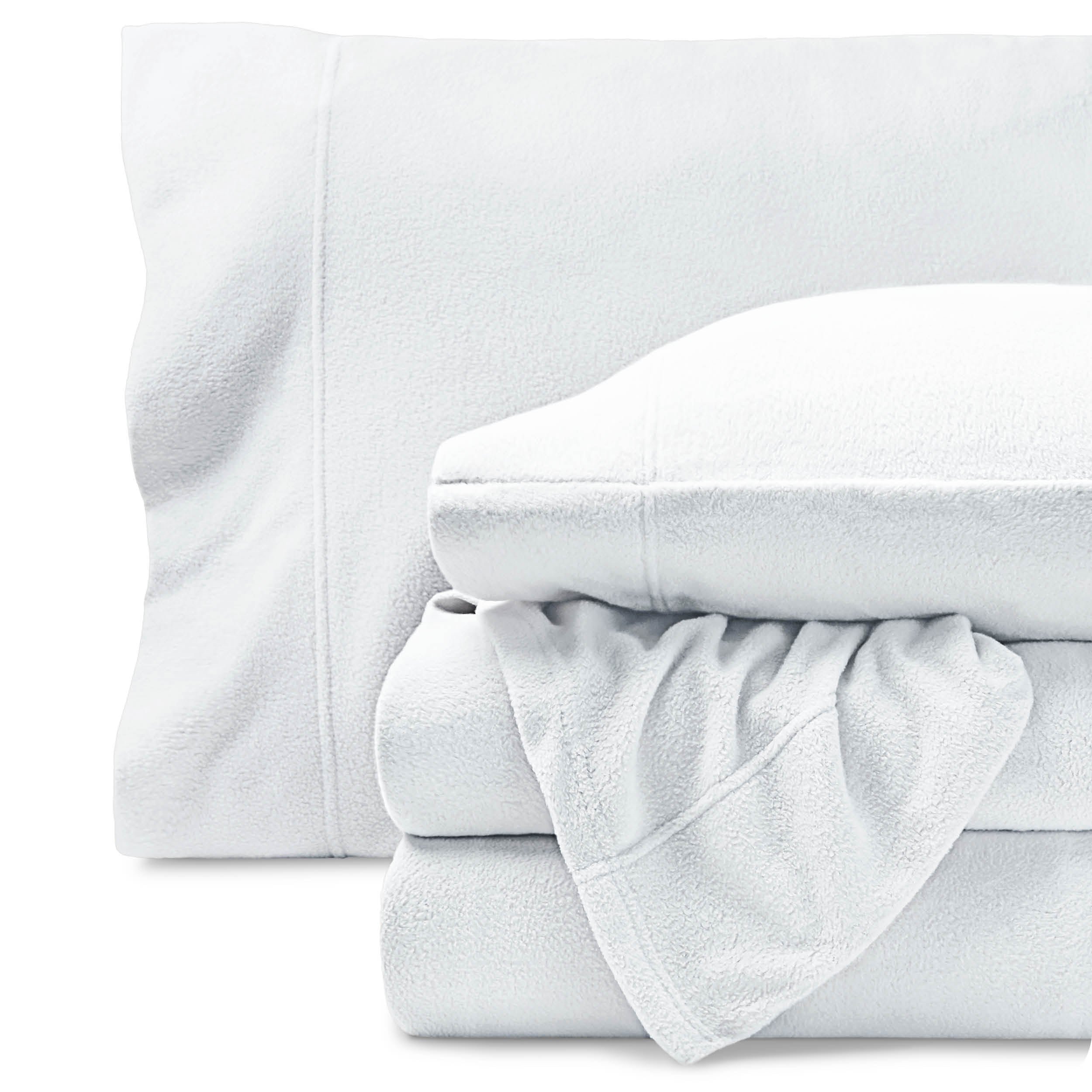 Fleece sheets folded neatly and stacked with pillows inside the pillowcases