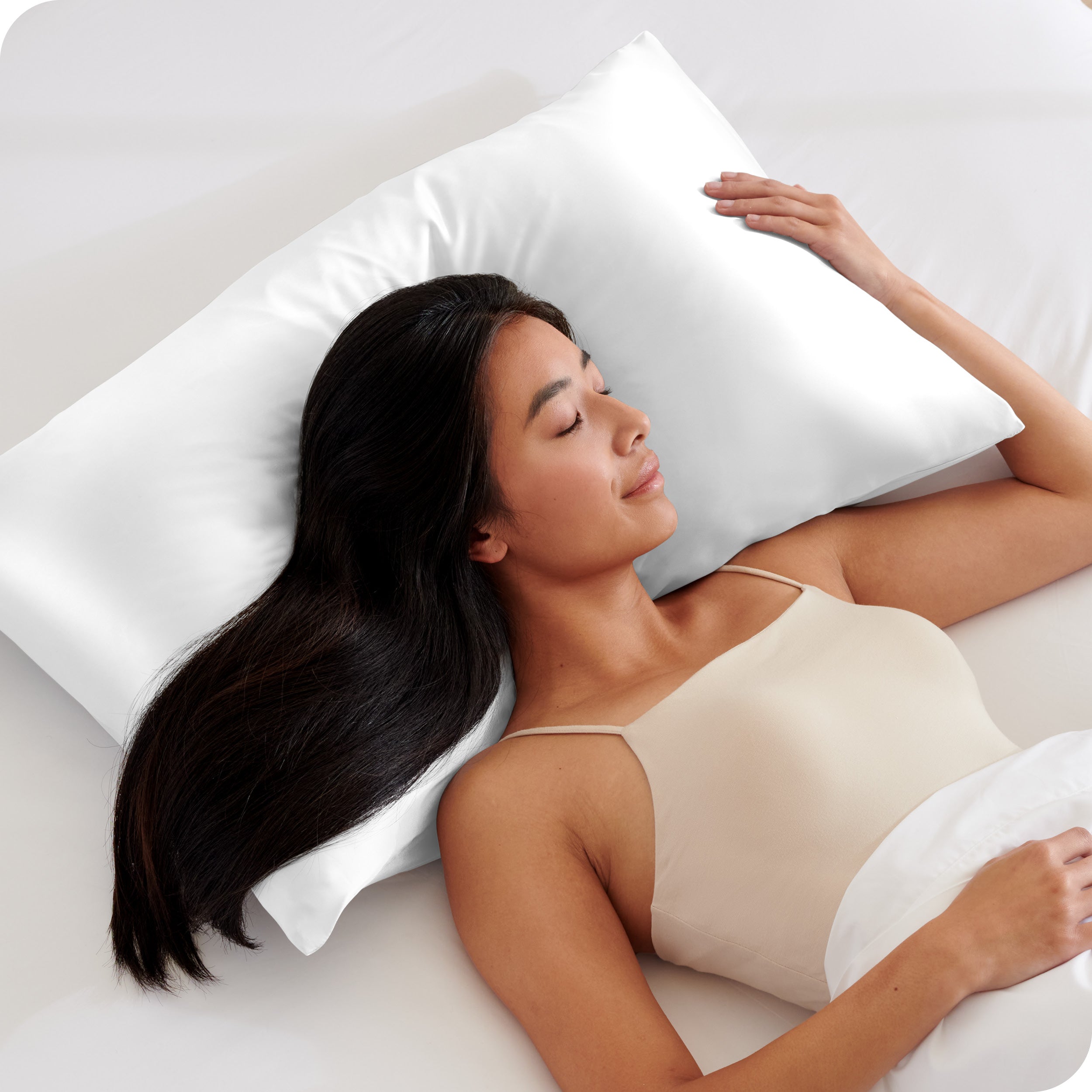 A woman sleeping on a silk pillowcase