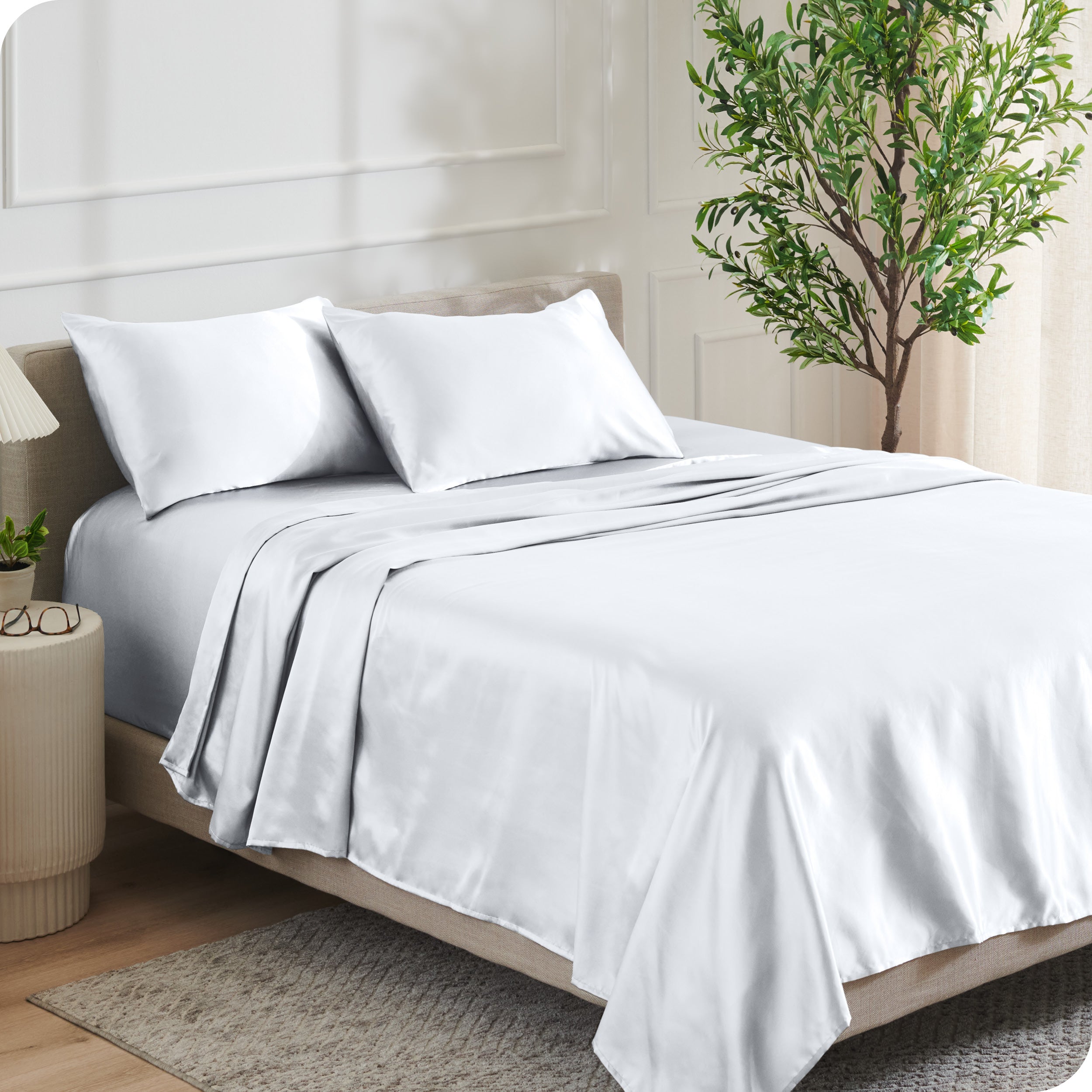 Satin sheets on a bed