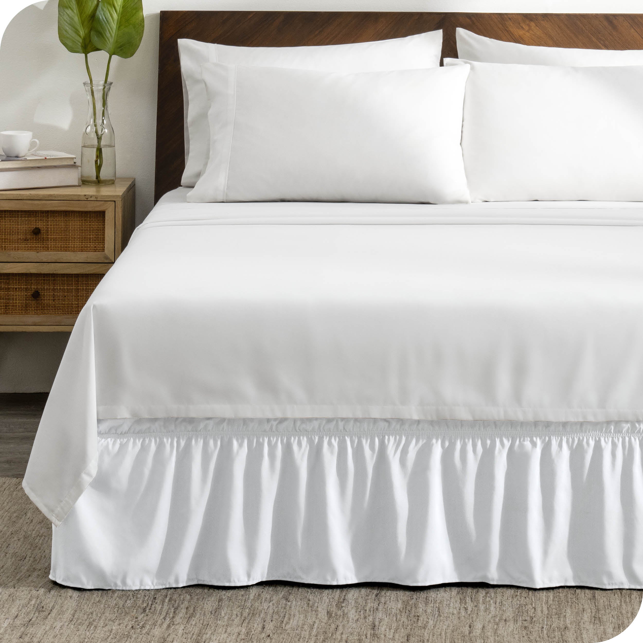 A wrap around bed skirt on a bed