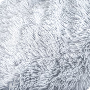Close up of the soft texture of a shaggy faux fur sherpa blanket