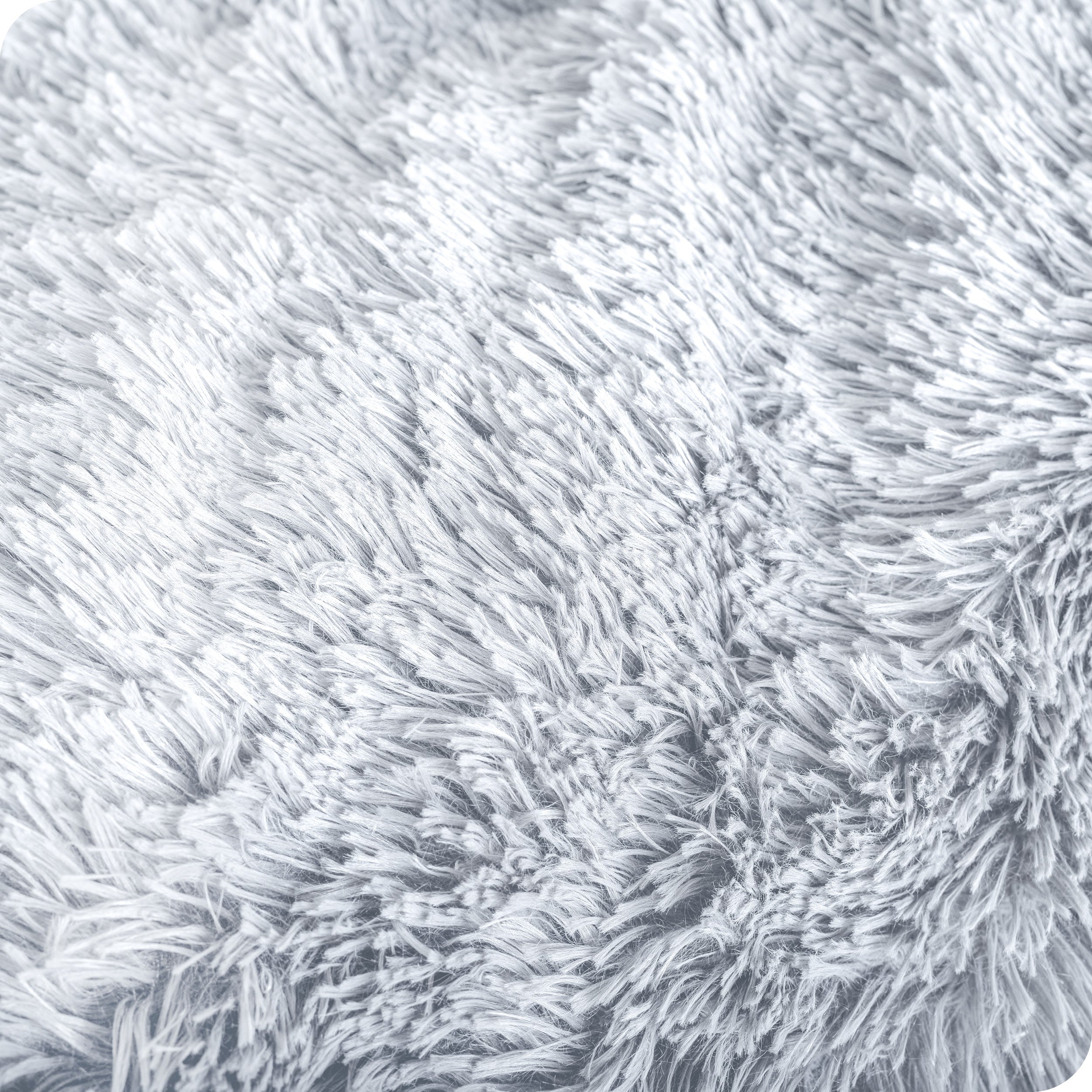 Close up of the soft texture of a shaggy faux fur sherpa blanket