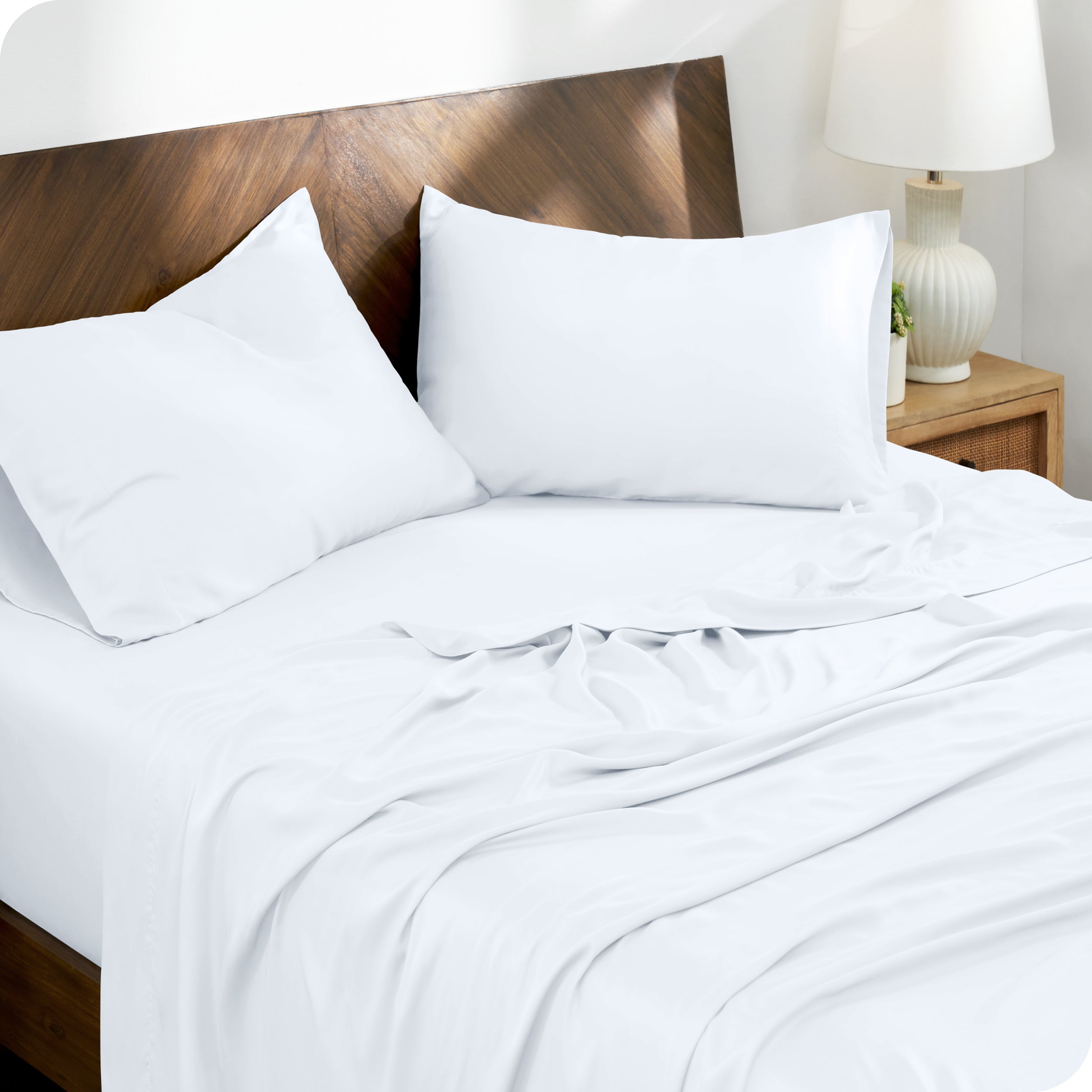 TENCEL™ Lyocell sheets on a bed. The flat sheet is folded over itself slightly.