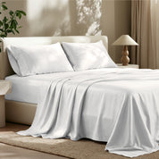 Tencel bed sheets and pillowcases on a bed in a bedroom setting.