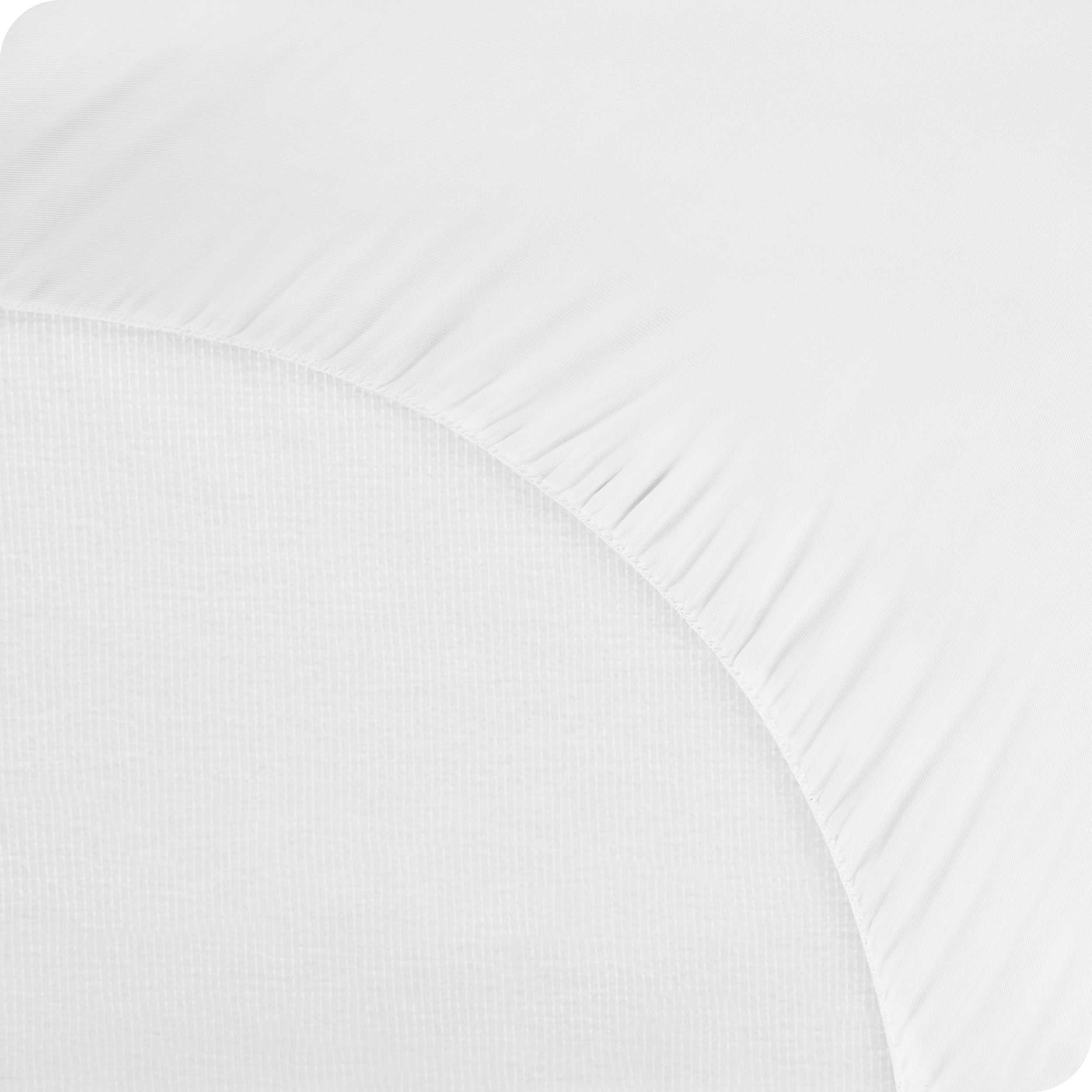 The bottom of a mattress protector on a mattress