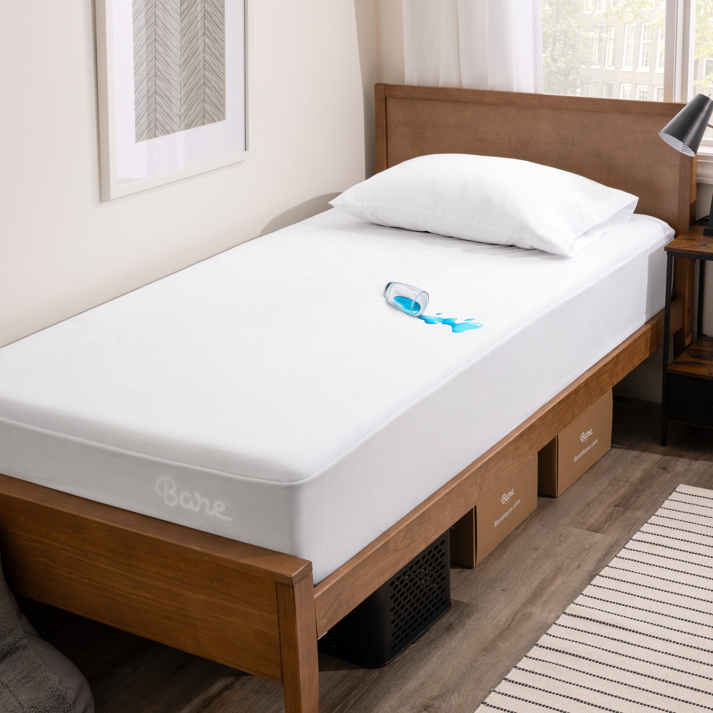 A glass of water spilled on a mattress protector