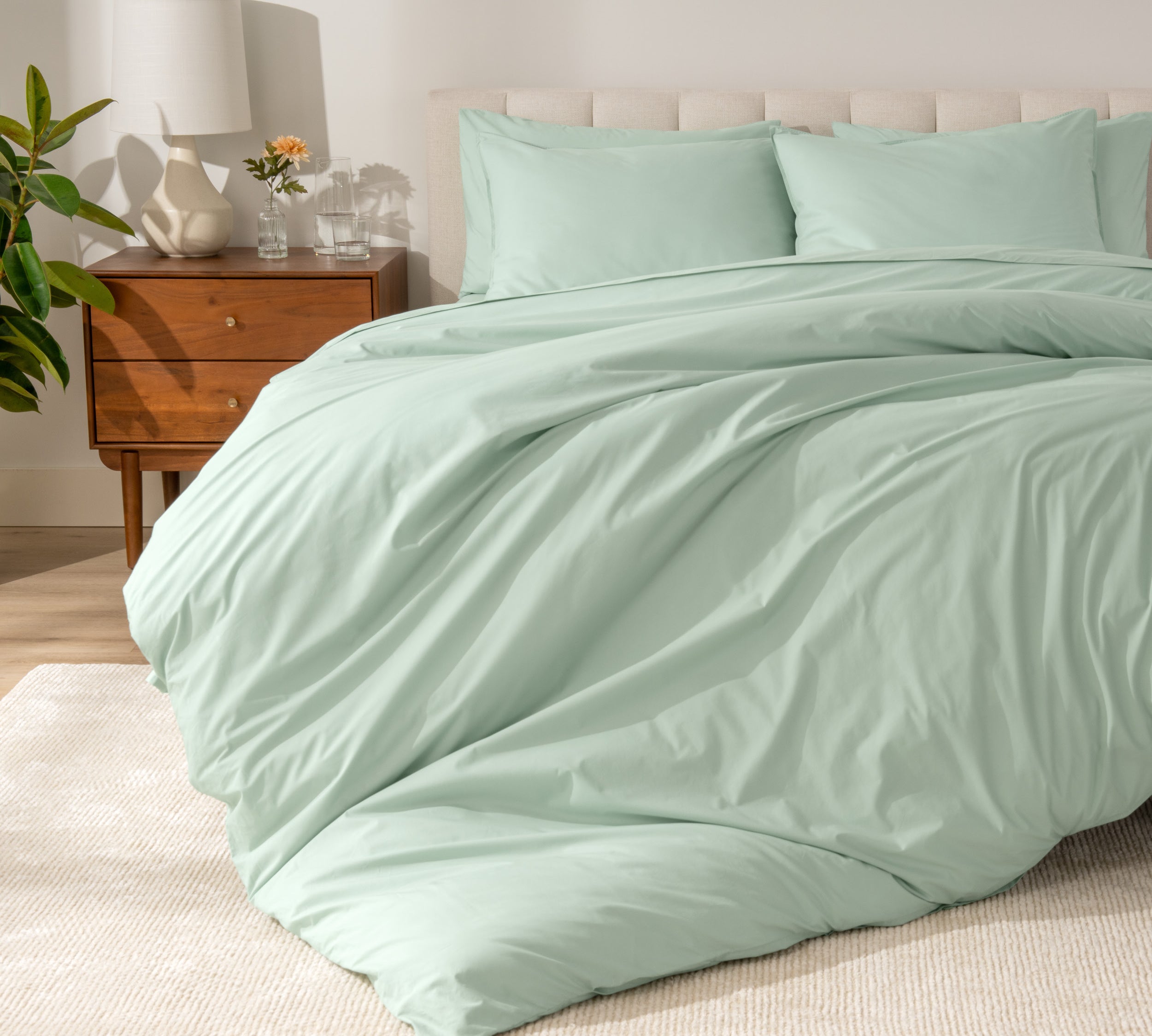 A modern bed with a organic cotton percale duvet cover on.