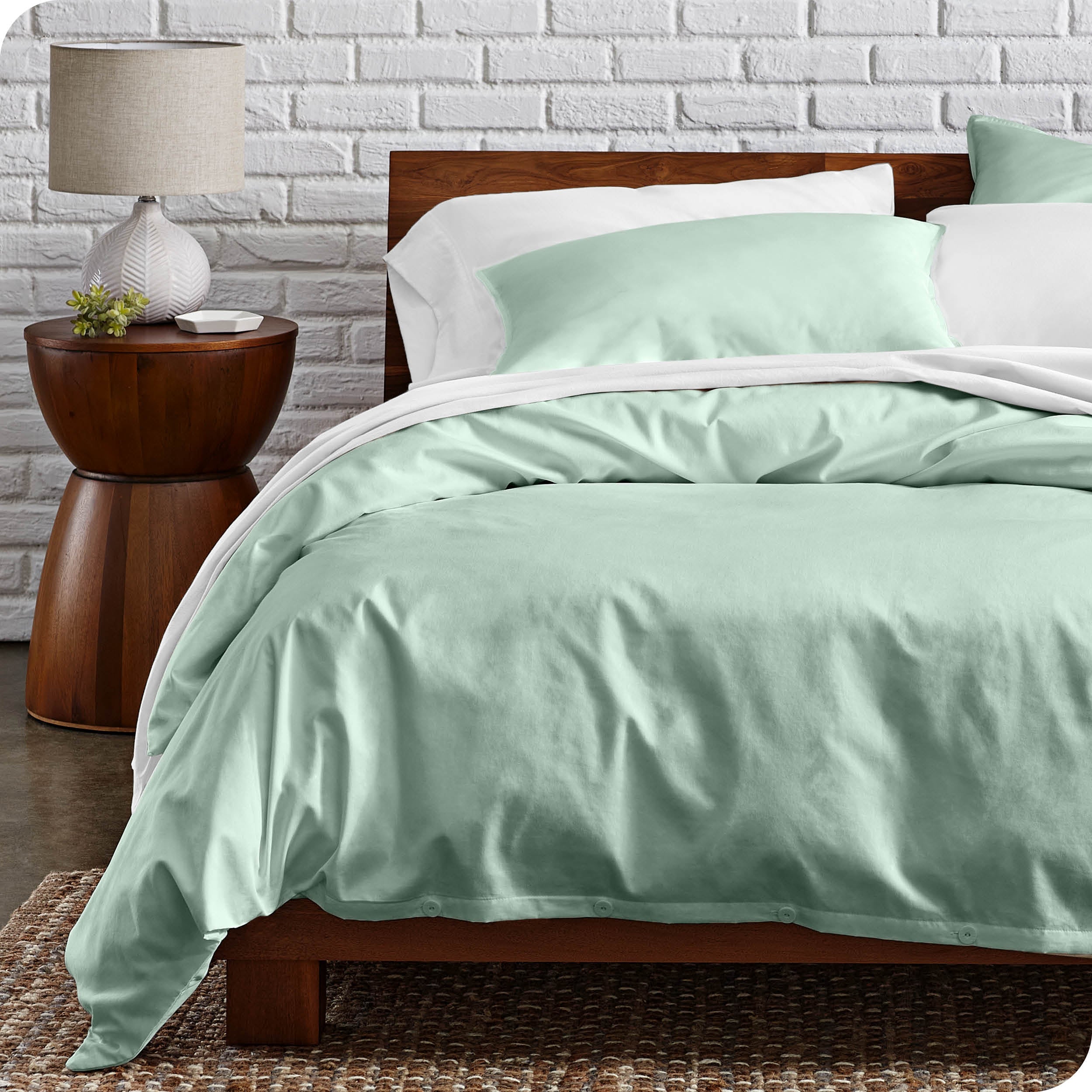 A modern bed with a organic cotton percale duvet cover on.