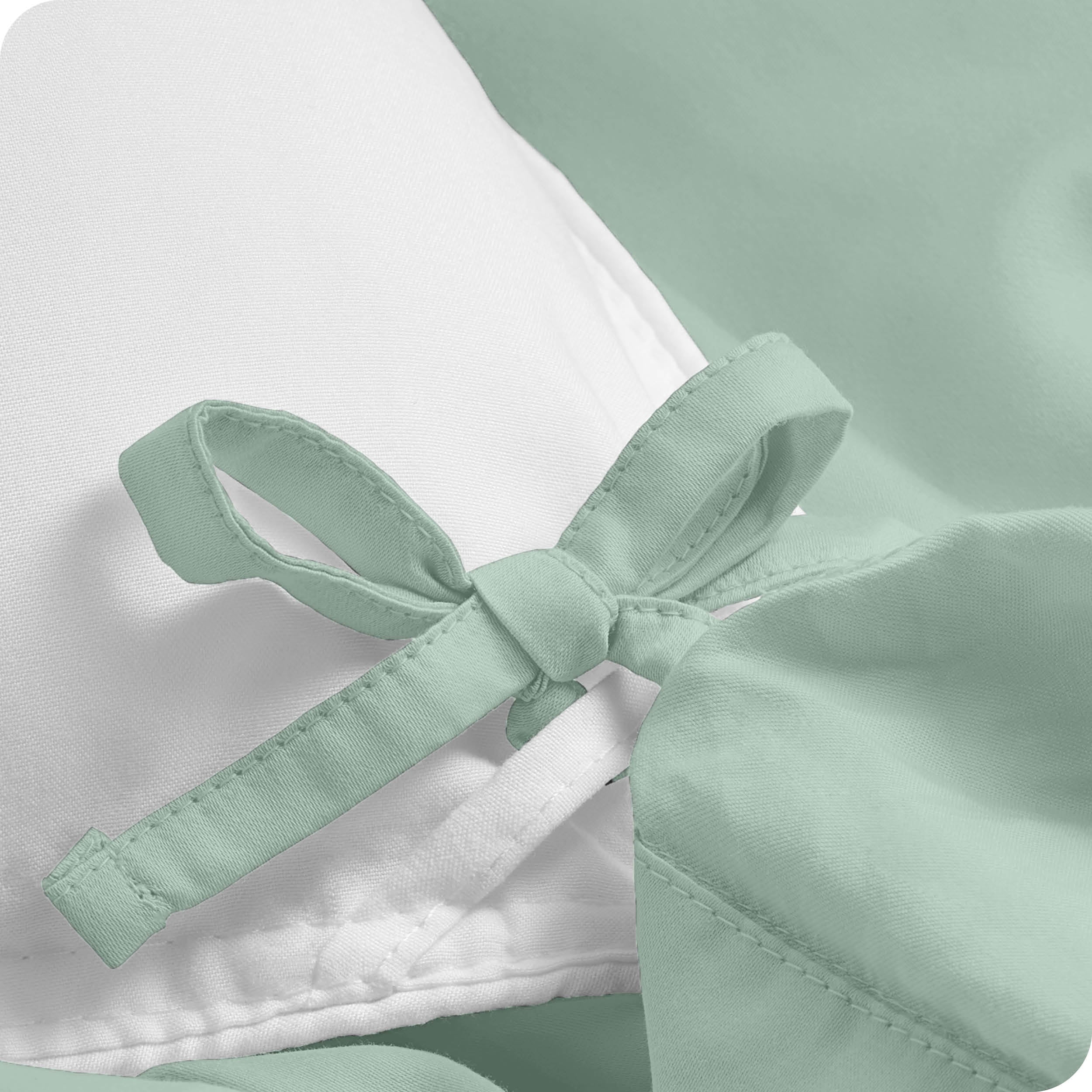 A close view of the corner tie of the duvet cover.