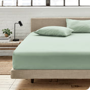 An organic cotton fitted sheet on a mattress
