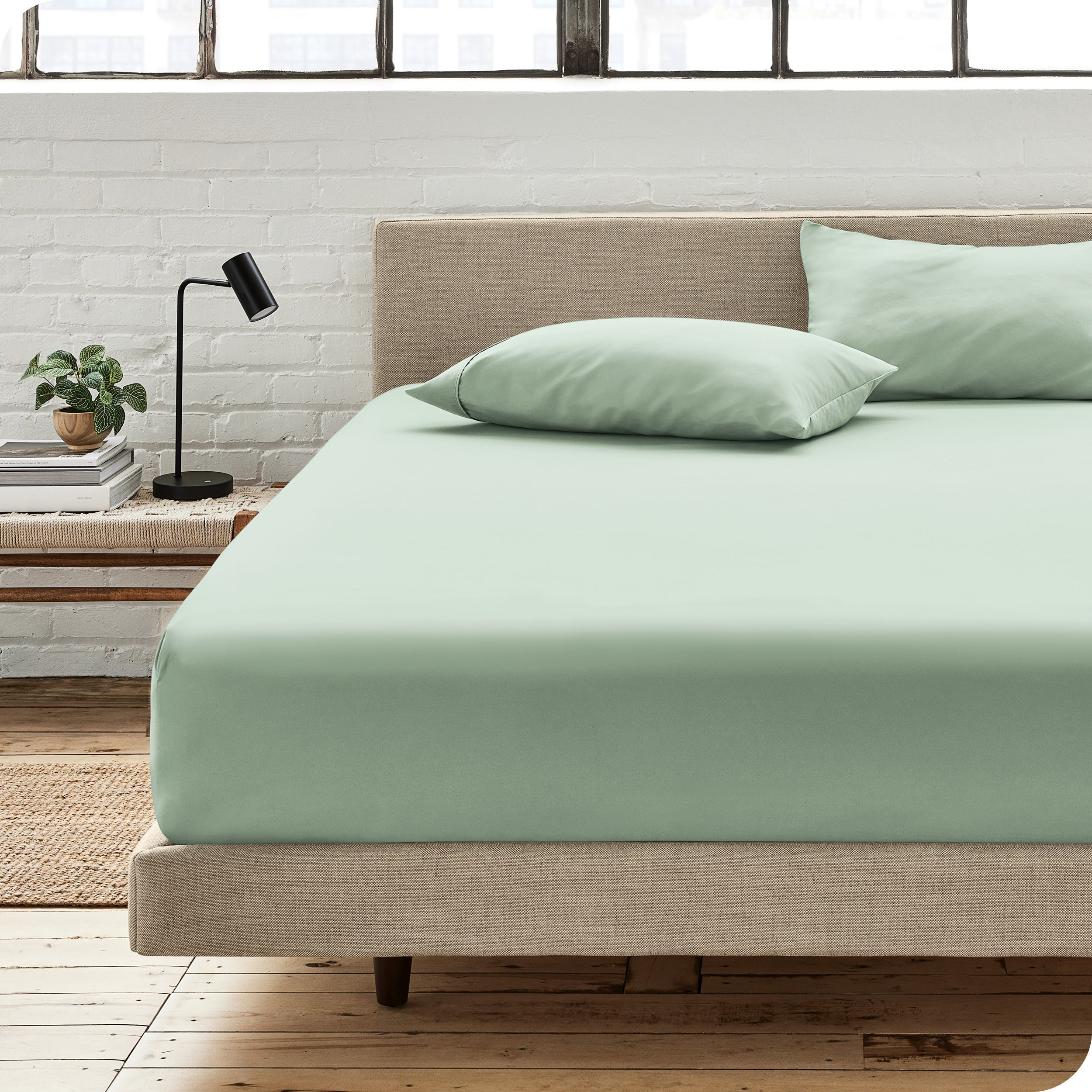 An organic cotton fitted sheet on a mattress