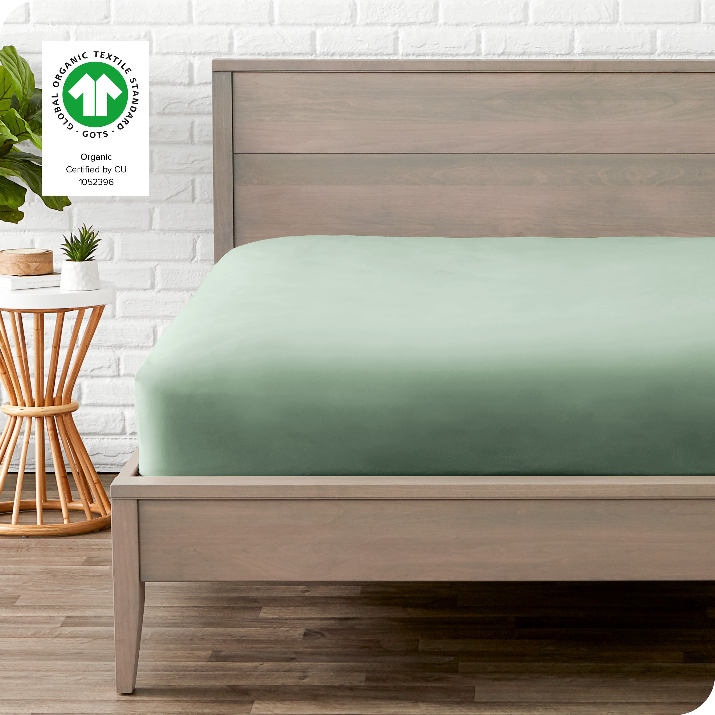 An organic percale bottom sheet on a mattress