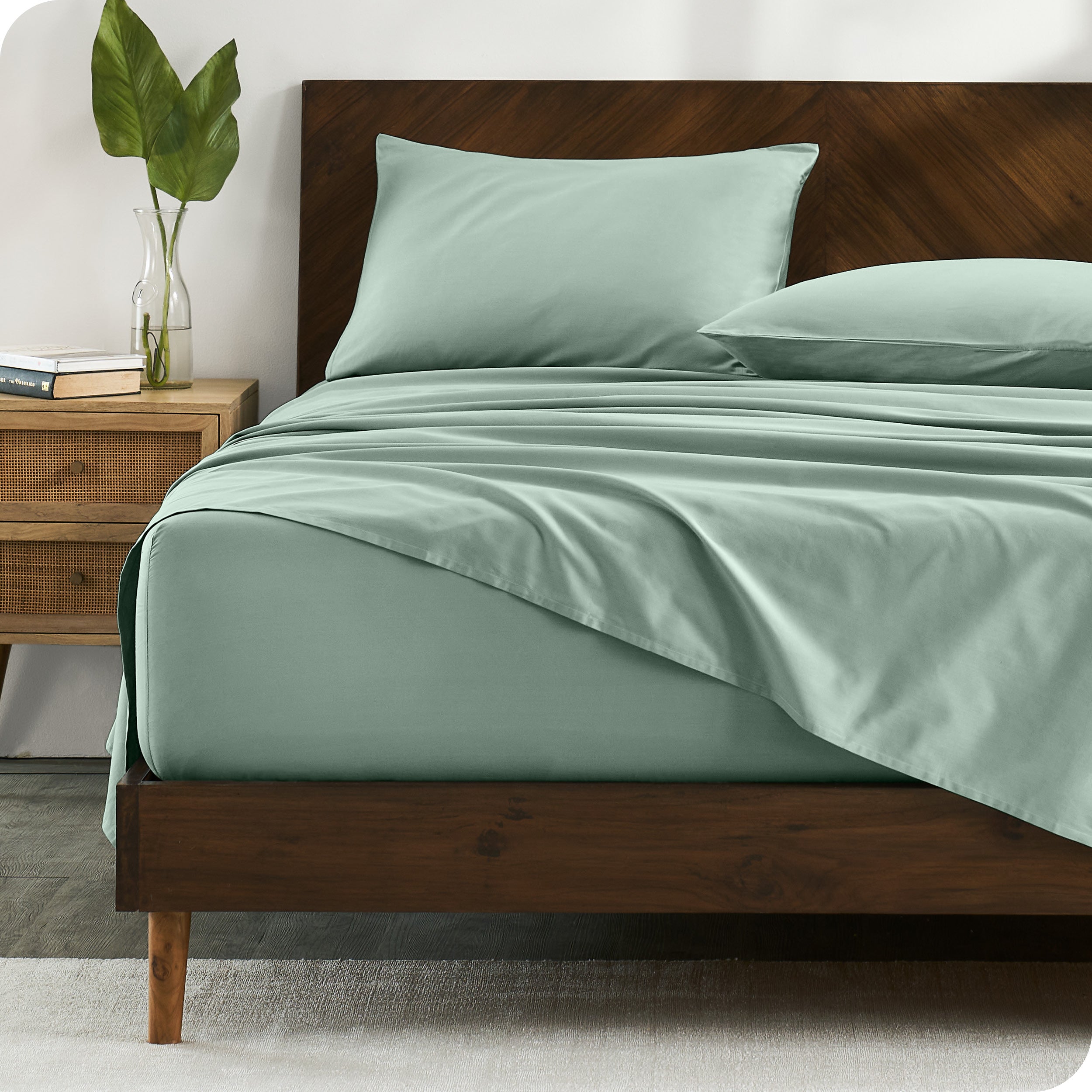 Percale sheets on bed in a modern bedroom