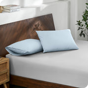 2 pillows with percale pillowcases on a bed