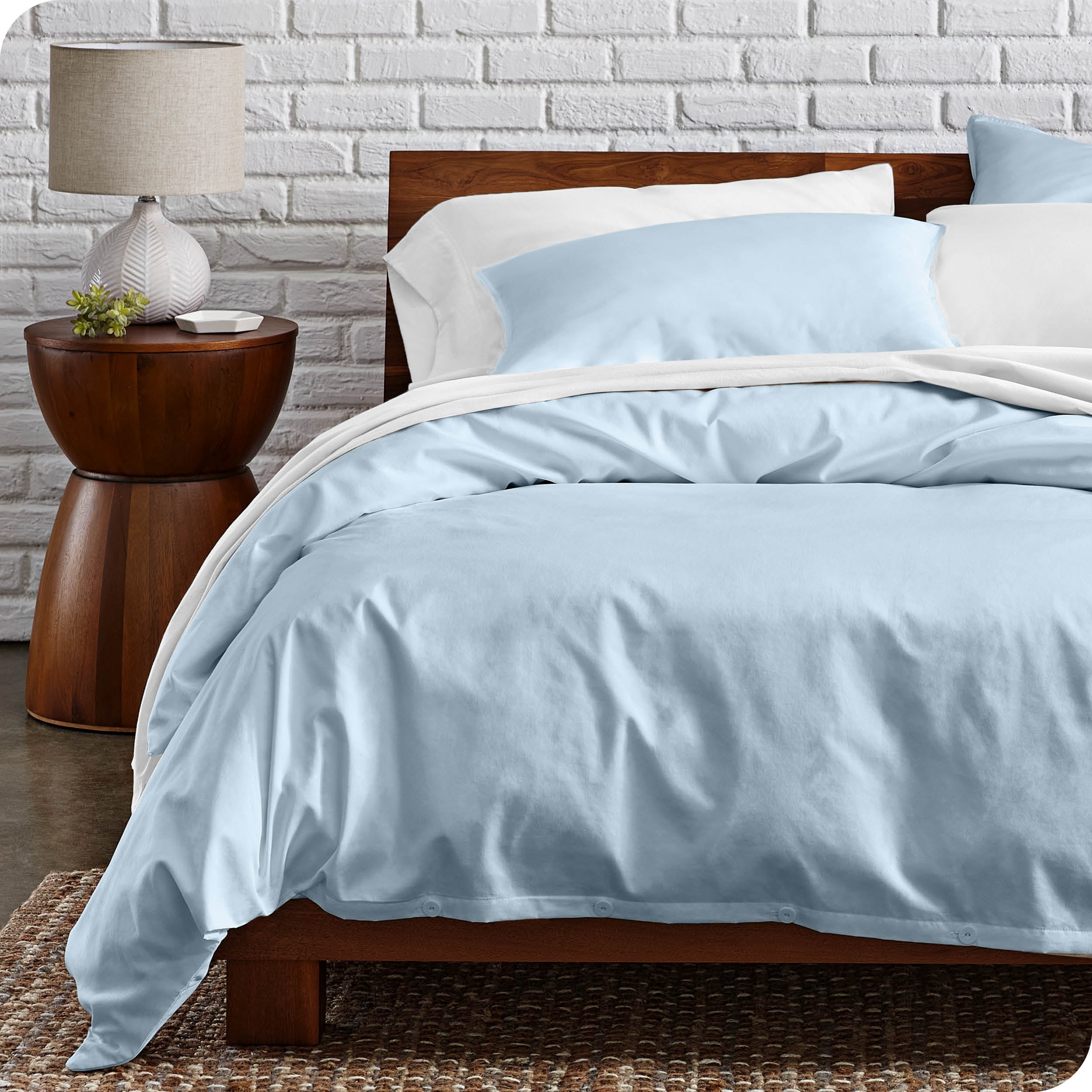 A modern bed with a organic cotton percale duvet cover on.