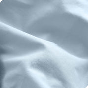 A close view of the oraganic cotton percale duvet cover showing the texture, color, and fabric.