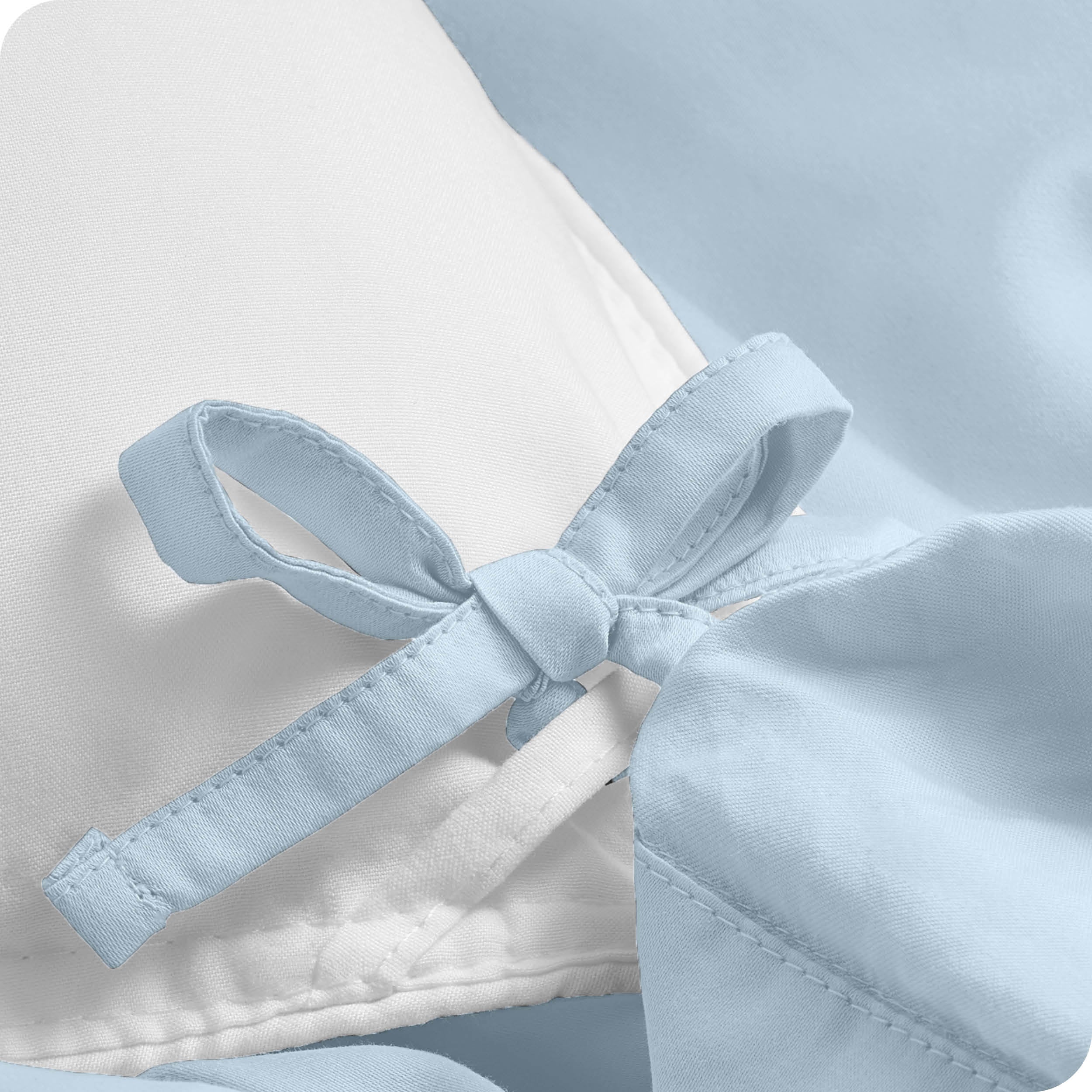 A close view of the corner tie of the duvet cover.