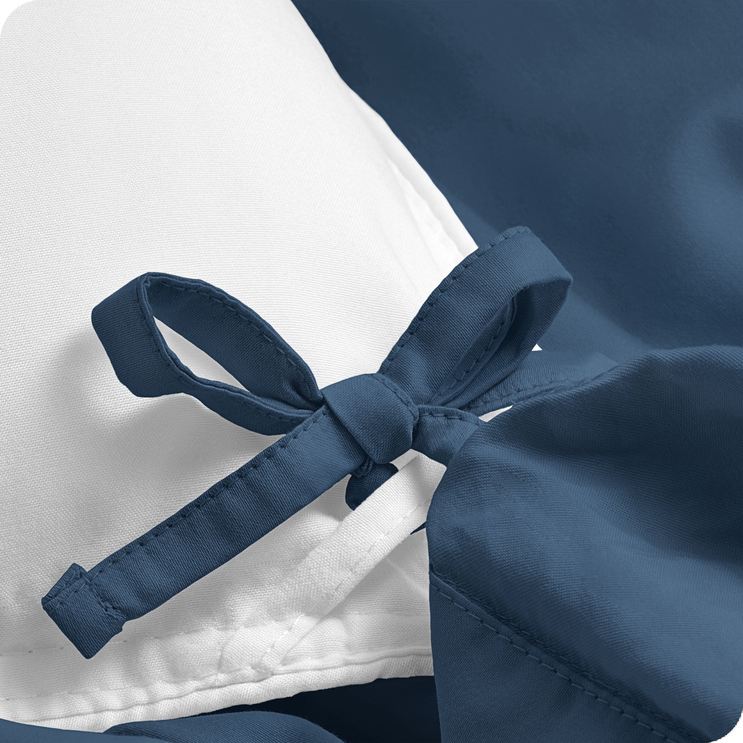 A close view of the corner tie of the duvet cover.